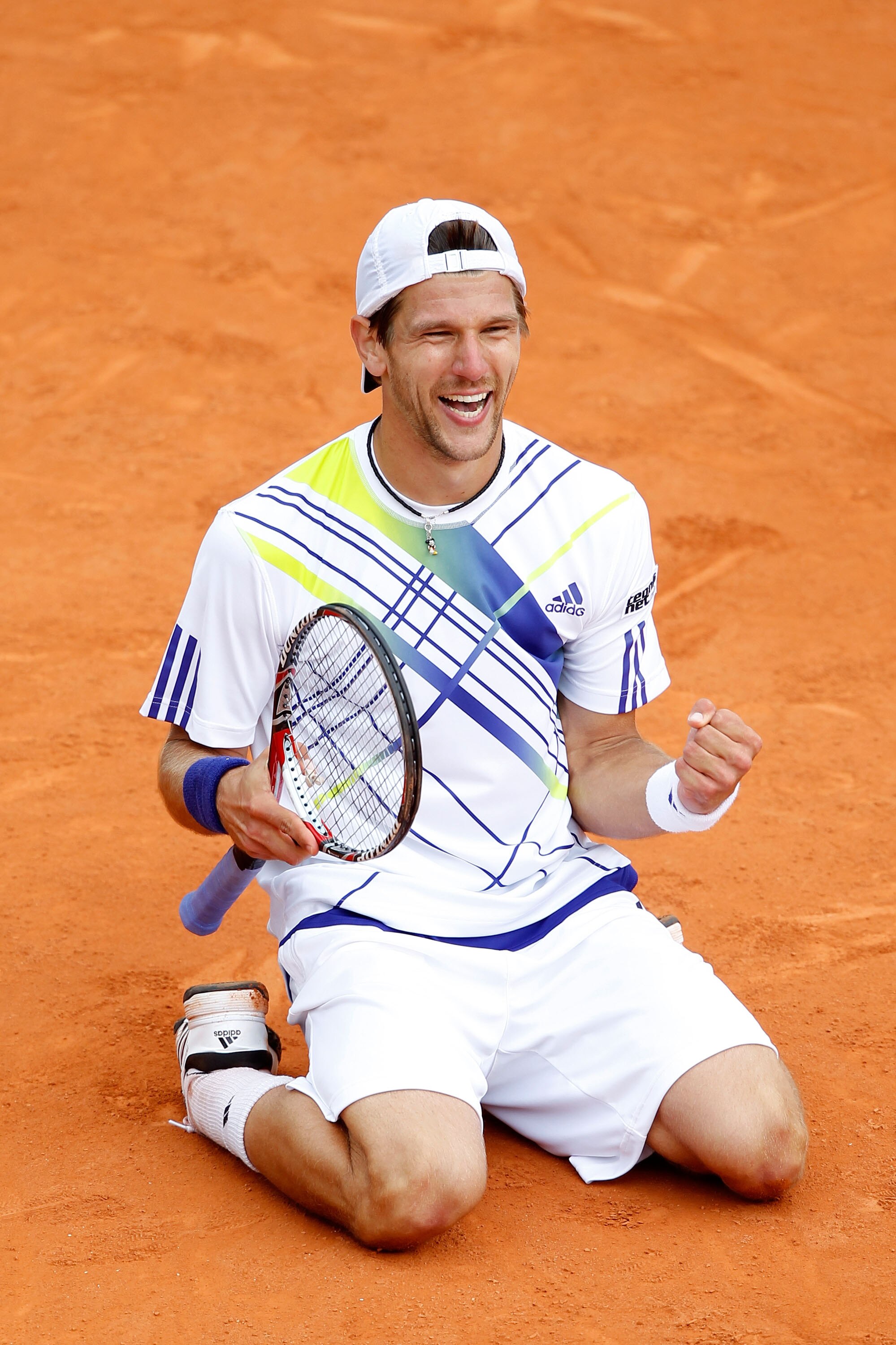 PARIS - MAY 29:  Jurgen Melzer of Austria celebrates match point during the men's singles third round match between David Ferrer of Spain and Jurgen Melzer of Austria on day seven of the French Open at Roland Garros on May 29, 2010 in Paris, France.  (Pho