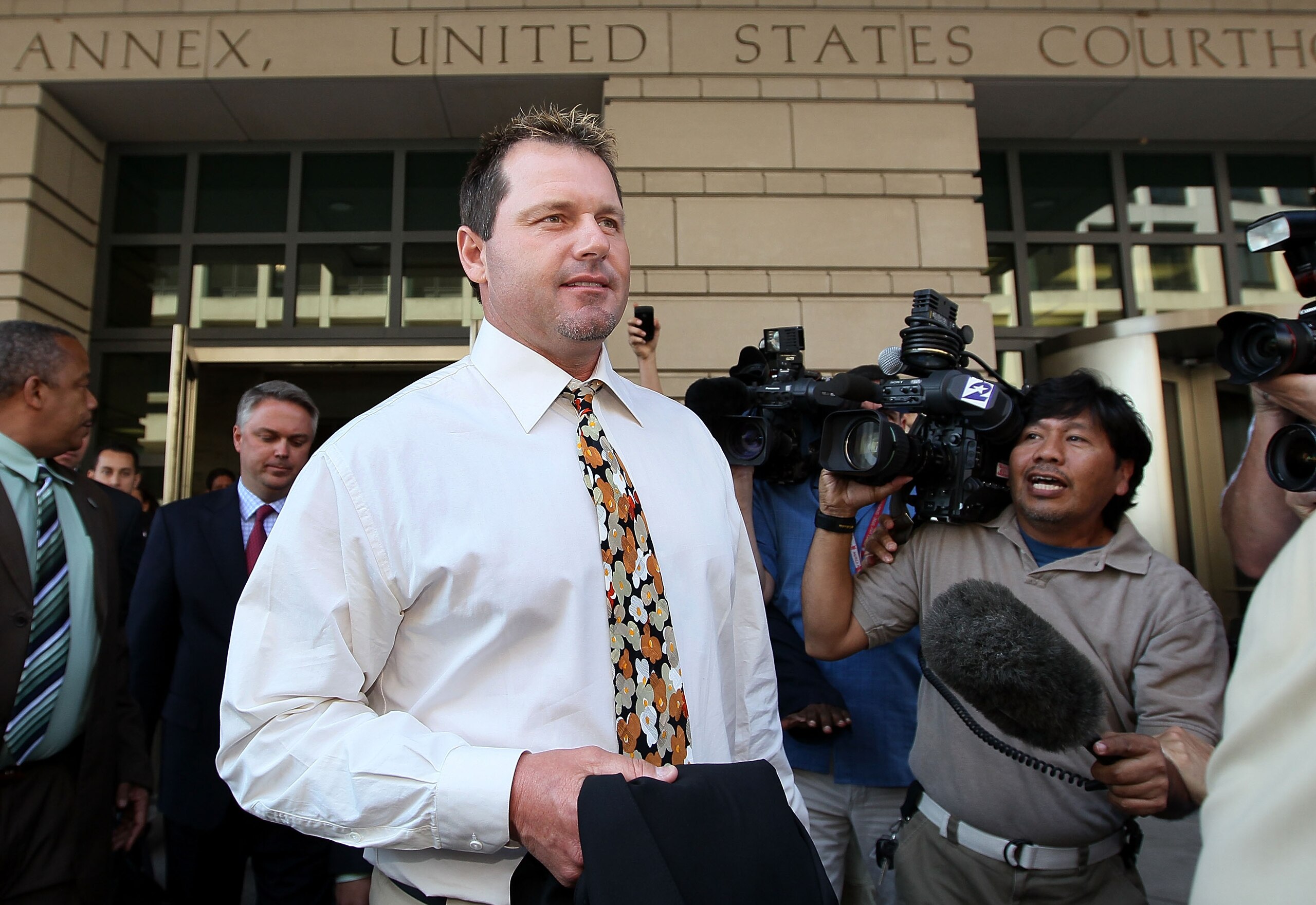 WASHINGTON - AUGUST 30:  Baseball pitching star Roger Clemens walks out of the U.S. District Court after his arraignment, on August 30, 2010 in Washington, DC. Clemens who plead not-guilty was charged with making false statements, perjury and obstructing