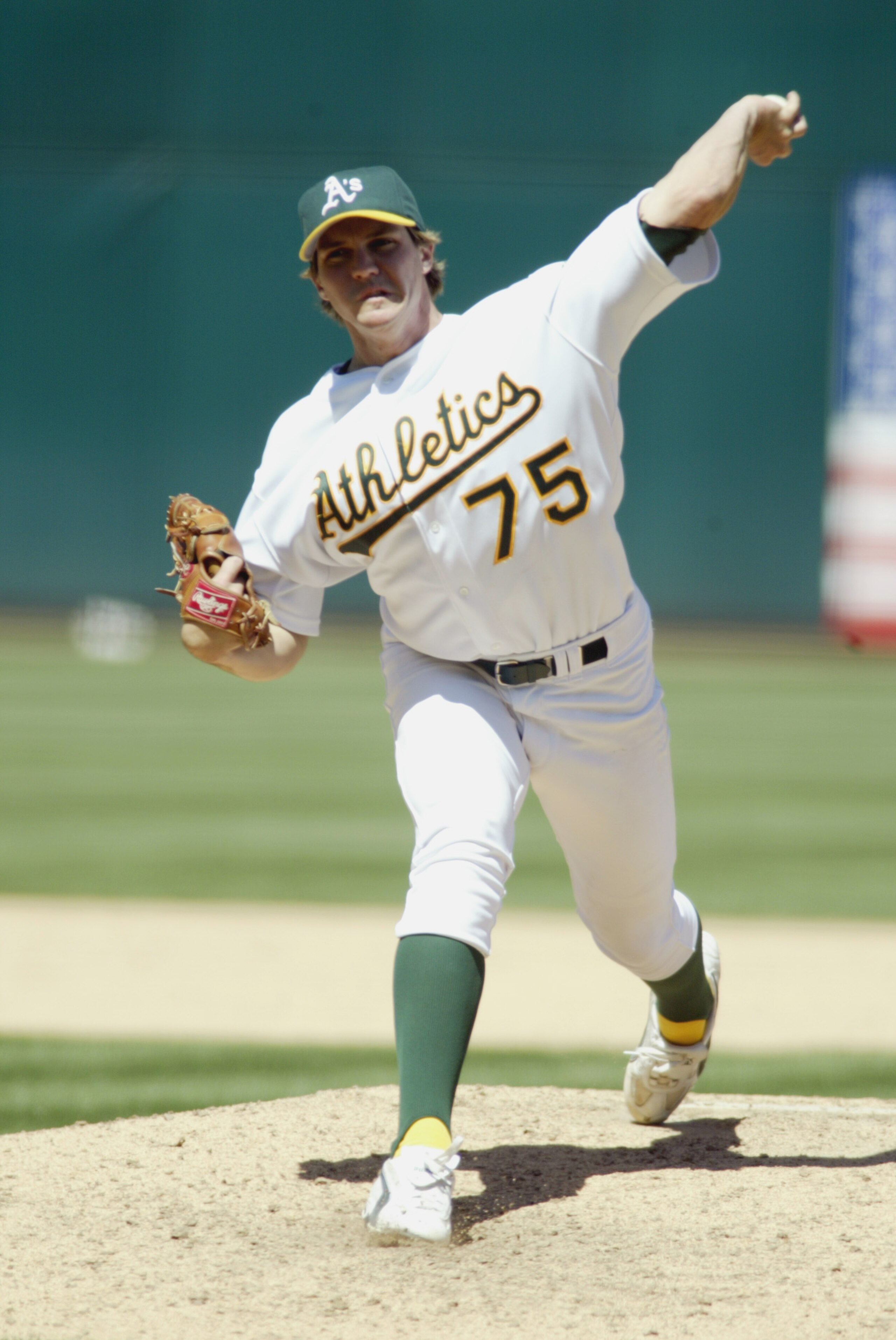 OAKLAND, CA - MAY 11:   Pitcher Barry Zito #75 of the Oakland A's throws a pitch against the Toronto Blue Jays during the MLB game at Network Associates Coliseum in Oakland, California on May 11, 2002.  The A's won  7-4. (Photo by Jed Jacobsohn/Getty Imag