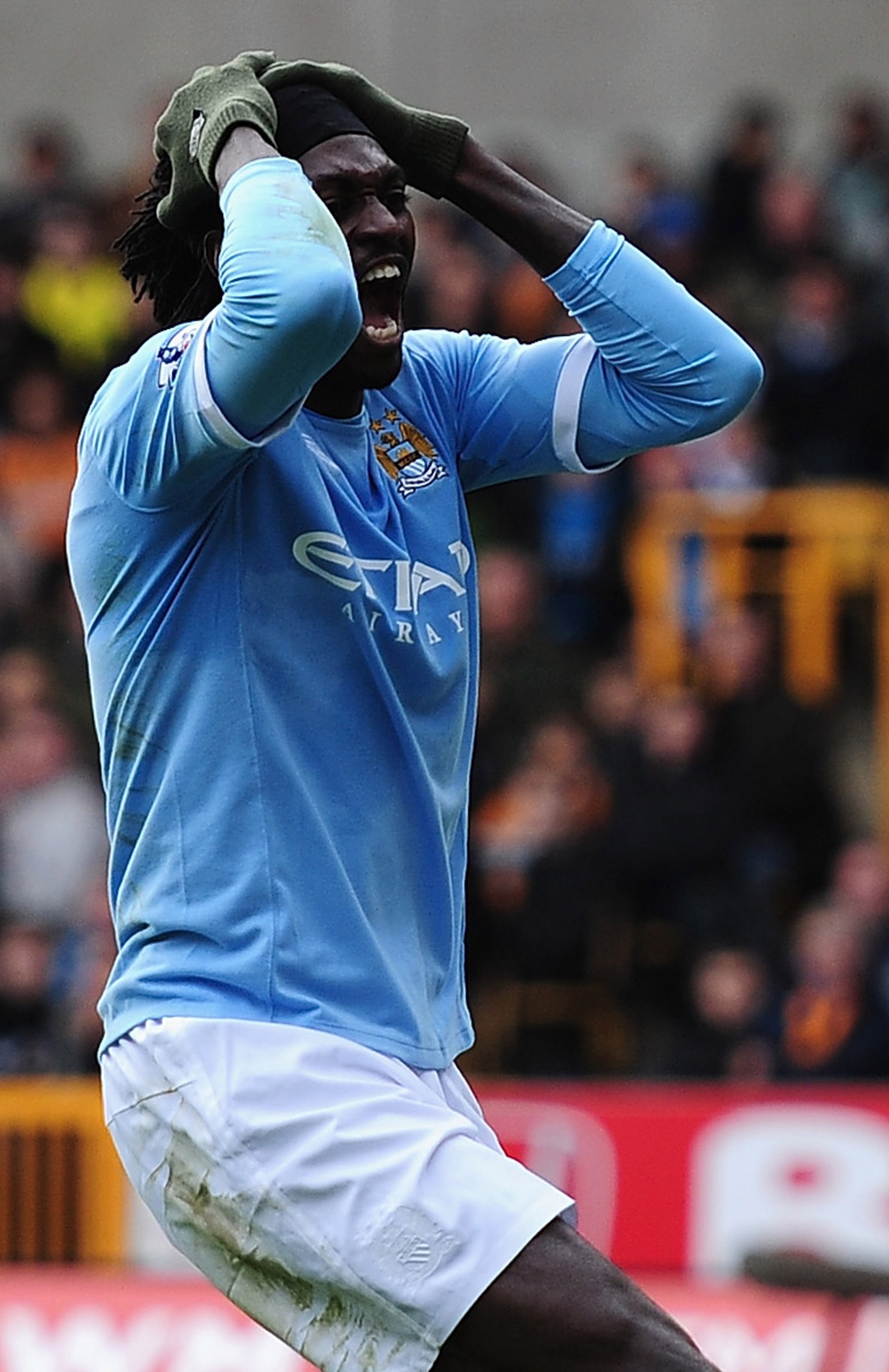 WOLVERHAMPTON, ENGLAND - OCTOBER 30:  Emmanuel Adebayor of Manchester City battles shows his frustrations after a wasted chance during the Barclays Premier League match between Wolverhampton Wanderers and Manchester City at Molineux on October 30, 2010 in