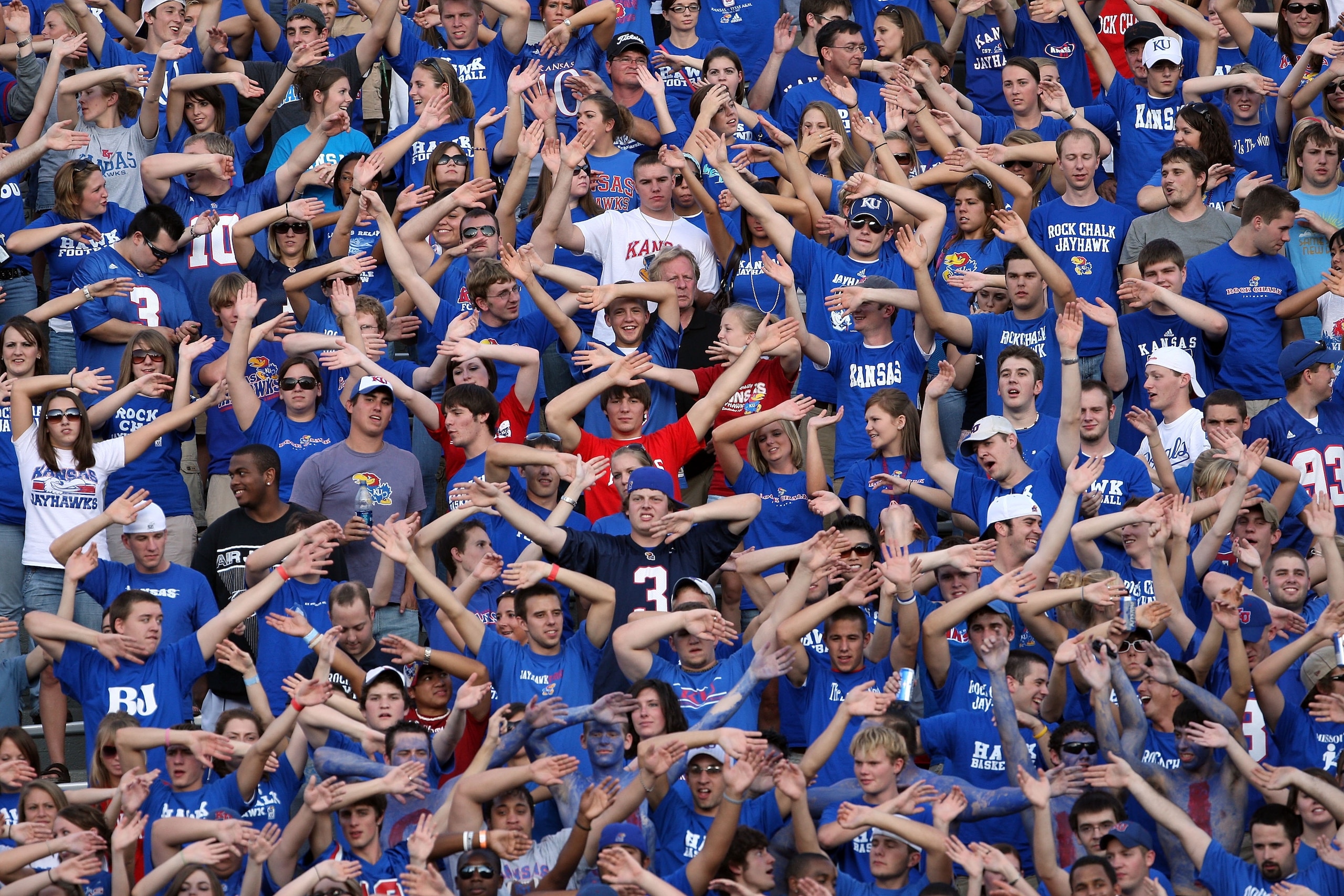 LAWRENCE, KS - SEPTEMBER 22:  Kansas Jayhawk fans cheer during the game against the Florida International Golden Panthers on September 22, 2007 at Memorial Stadium in Lawrence, Kansas.  (Photo by Jamie Squire/Getty Images)