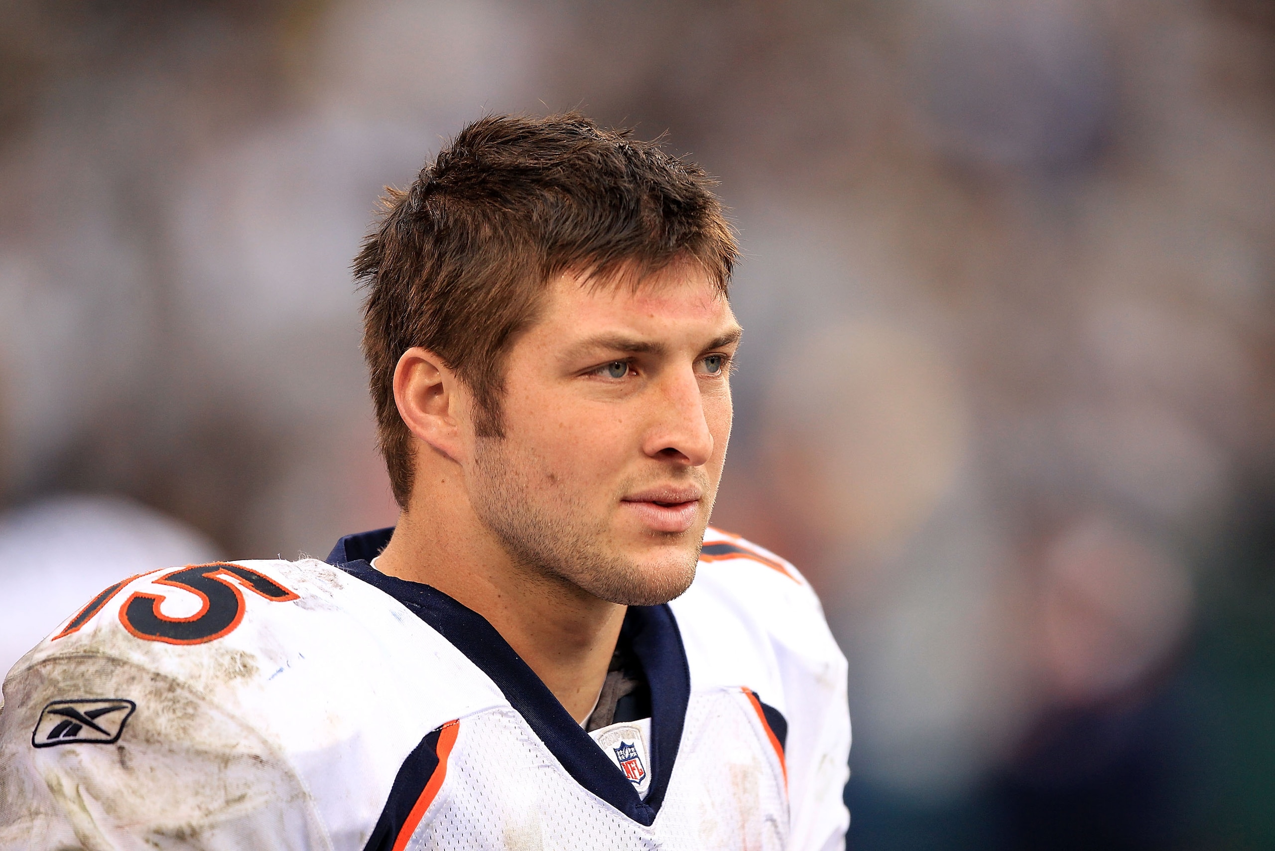 OAKLAND, CA - DECEMBER 19:  Tim Tebow #15 of the Denver Broncos stands on the sideline during their game against the Oakland Raiders at Oakland-Alameda County Coliseum on December 19, 2010 in Oakland, California.  (Photo by Ezra Shaw/Getty Images)