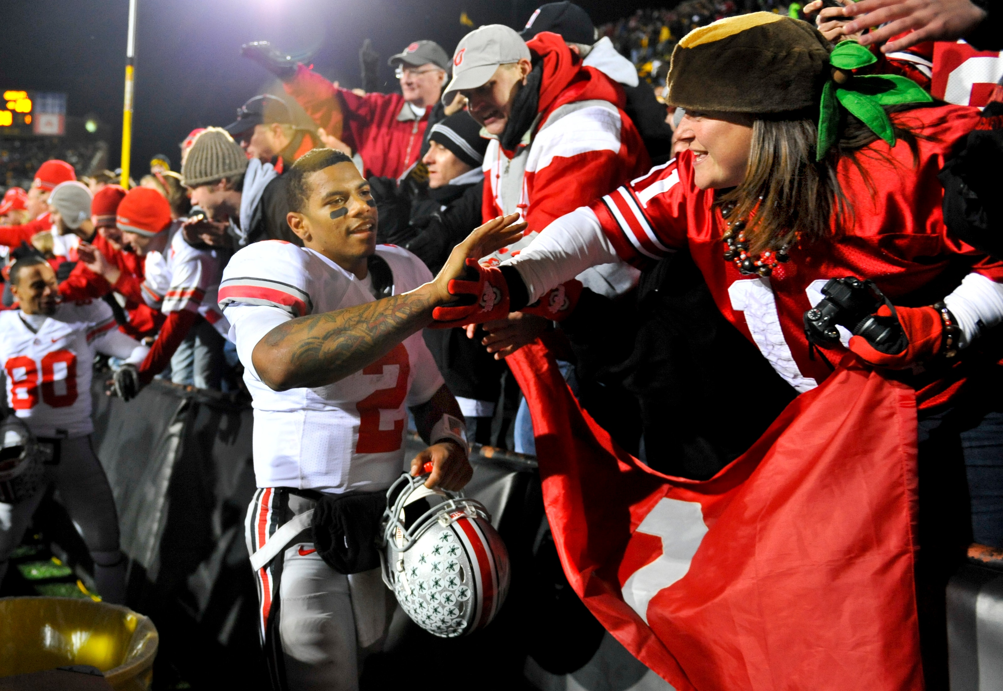 IOWA CITY, IA - NOVEMBER 20: Quarterback Terrelle Pryor #2 of the Ohio State Buckeyes celebrates with fans after beating the University of Iowa Hawkeyes at Kinnick Stadium on November 20, 2010 in Iowa City, Iowa. Ohio State won 20-17 over Iowa. (Photo by
