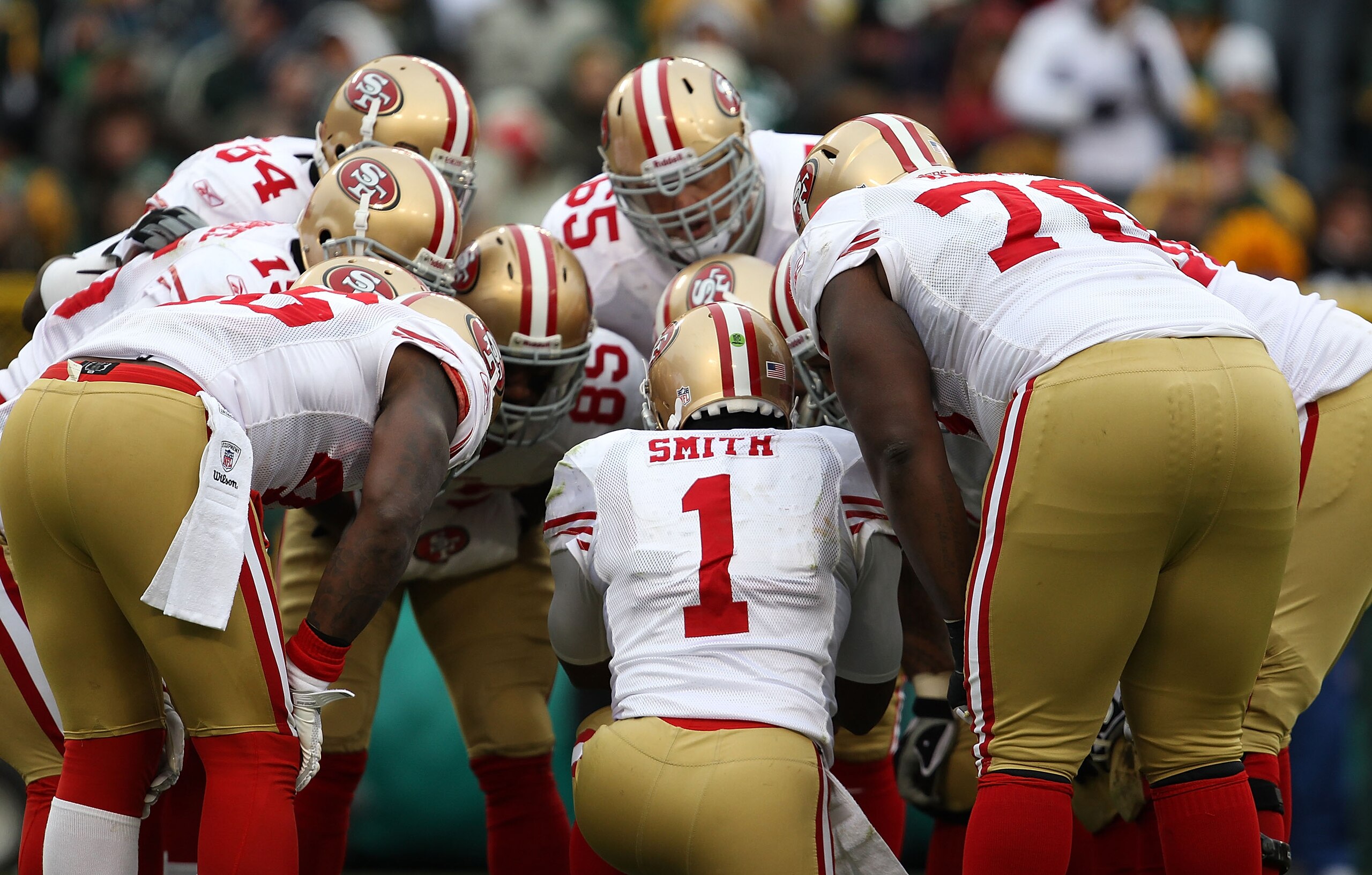 GREEN BAY, WI - DECEMBER 05: Troy Smith #1 of the San Francisco 49ers calls a play in the huddle against the Green Bay Packers at Lambeau Field on December 5, 2010 in Green Bay, Wisconsin. The Packers defeated the 49ers 34-16. (Photo by Jonathan Daniel/Ge