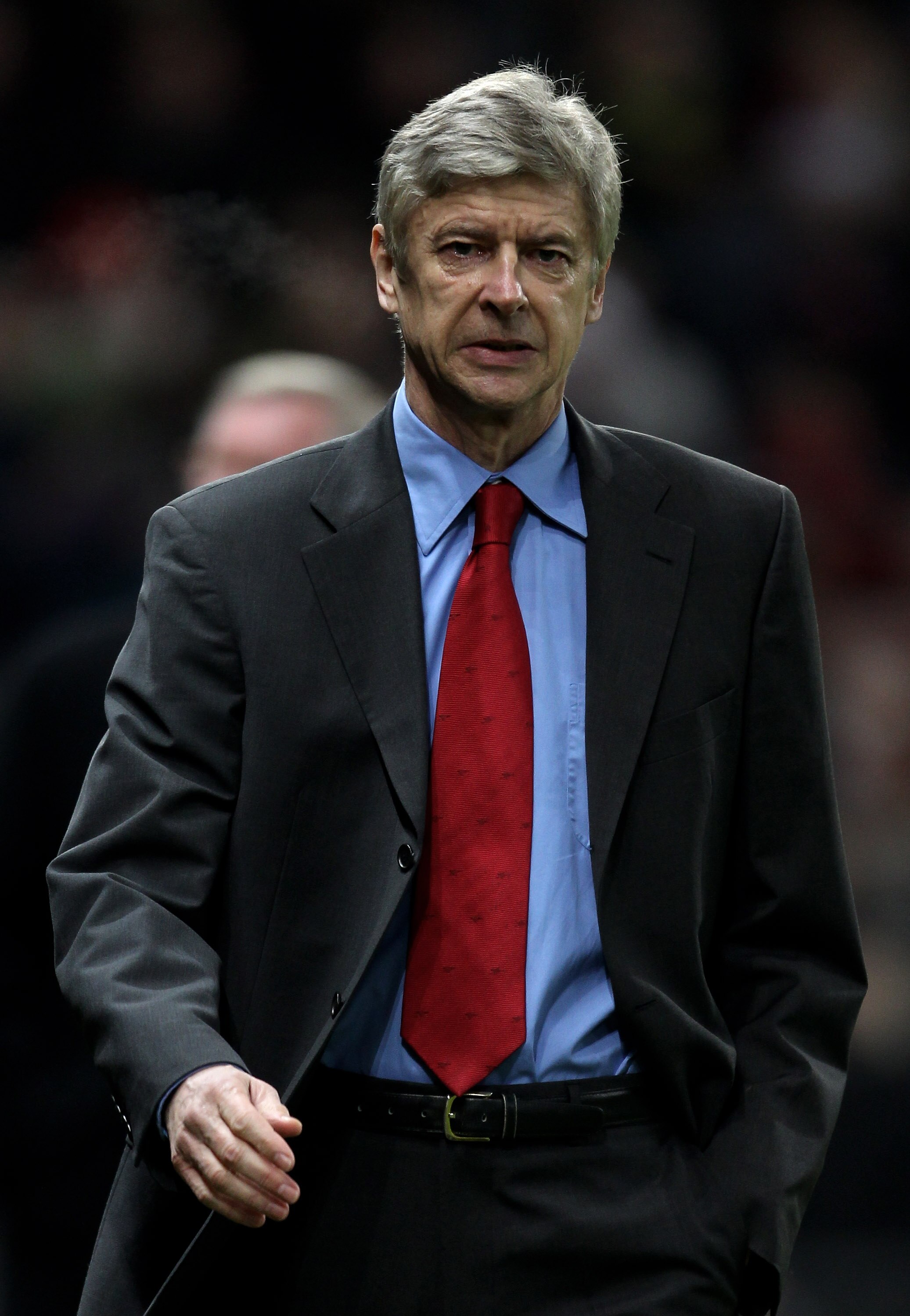 MANCHESTER, UNITED KINGDOM - DECEMBER 13:   Arsenal Manager Arsene Wenger heads for the dugout prior to the Barclays Premier League match between Manchester United and Arsenal at Old Trafford on December 13, 2010 in Manchester, England. (Photo by Alex Liv