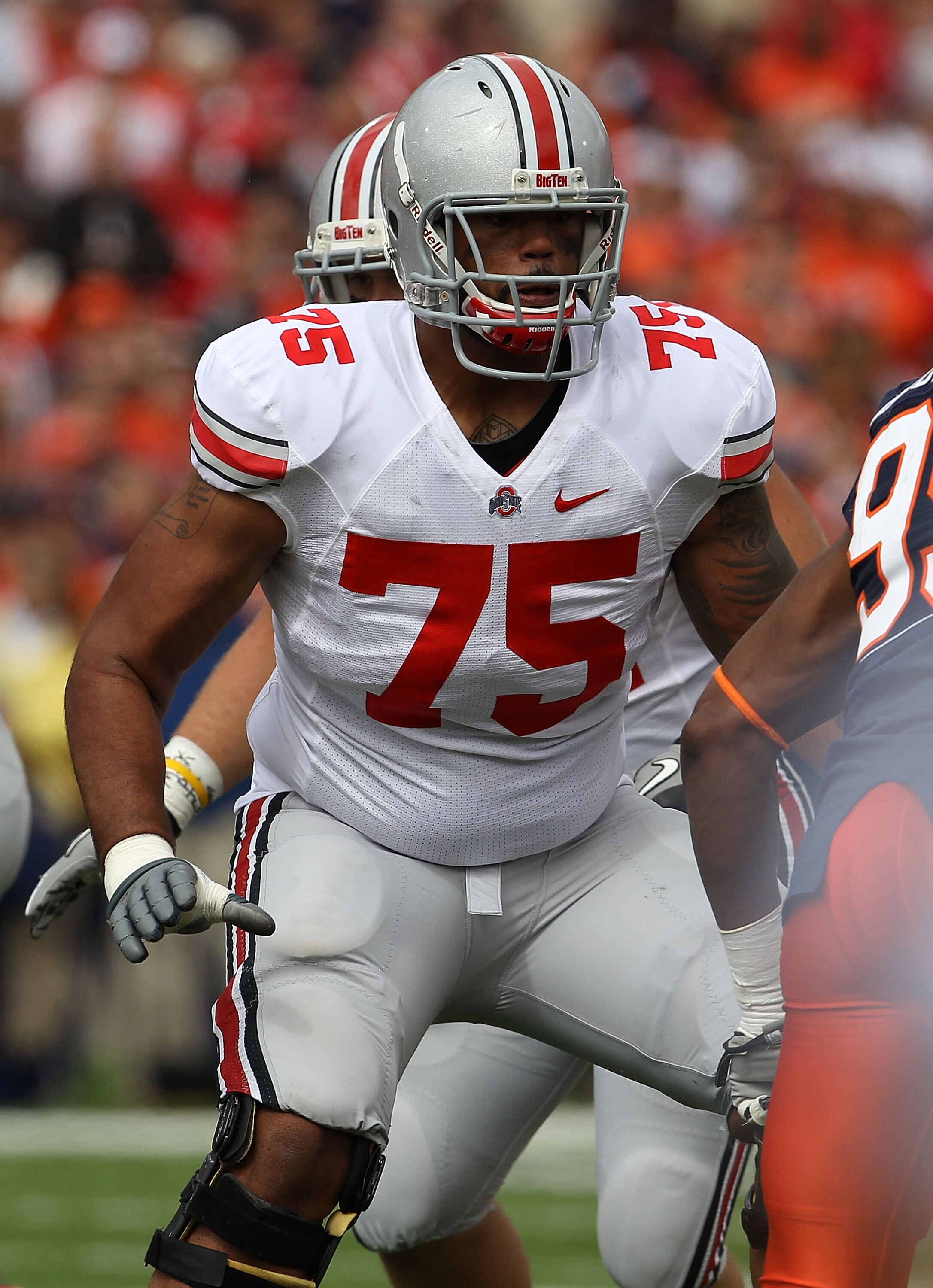 CHAMPAIGN, IL - OCTOBER 02: Mike Adams #75 of the Ohio State Buckeyes prepares to block against the Illinois Fighting Illini at Memorial Stadium on October 2, 2010 in Champaign, Illinois. Ohio State defeated Illinois 24-13. (Photo by Jonathan Daniel/Getty