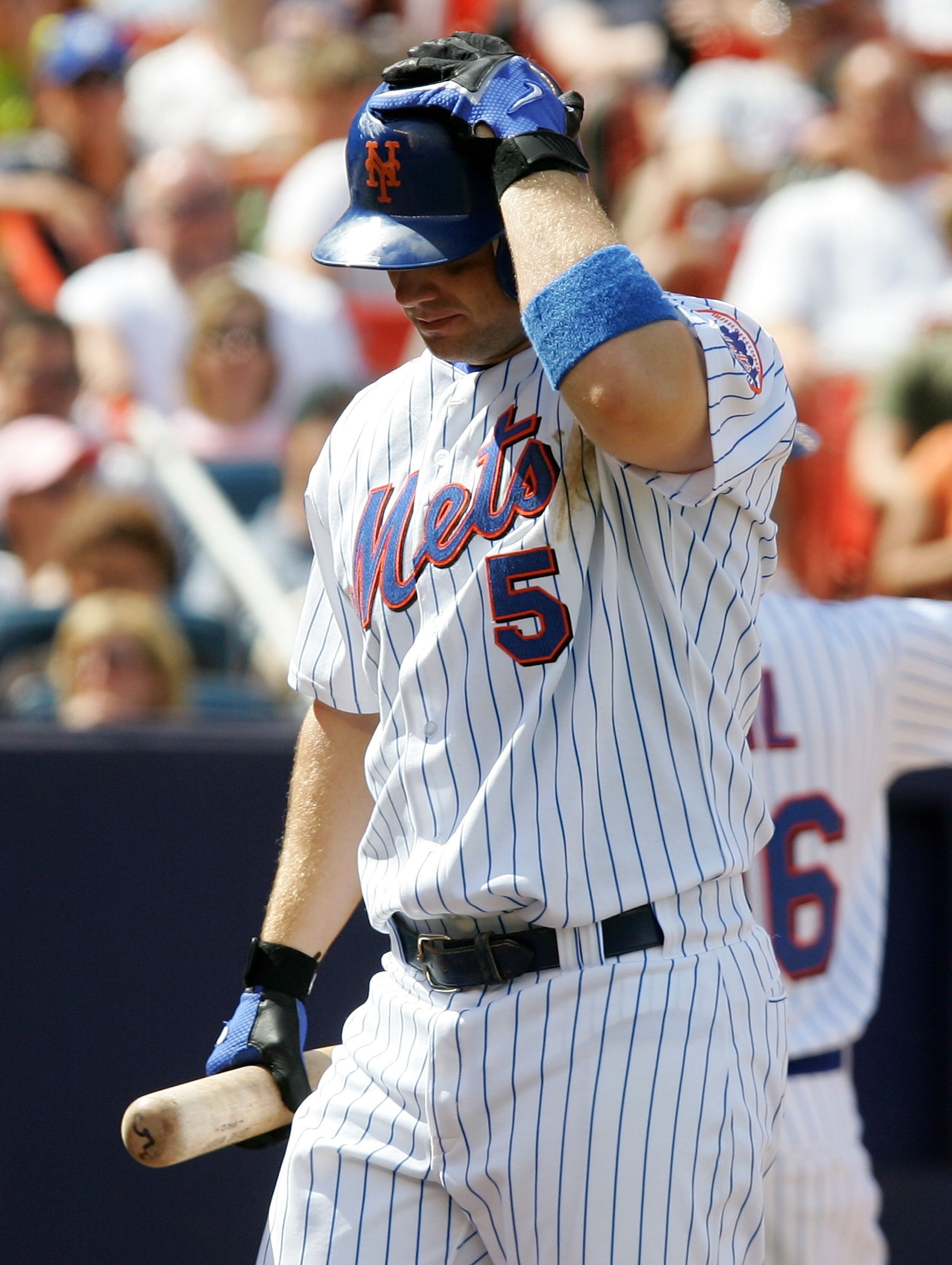 NEW YORK - JULY 23:  David Wright #5 of the New York Mets walks back to the dugout after striking out in the seventh inning against the Houston Astros on July 23, 2006 at Shea Stadium in the Flushing neighborhood of the Queens borough of New York City. Th