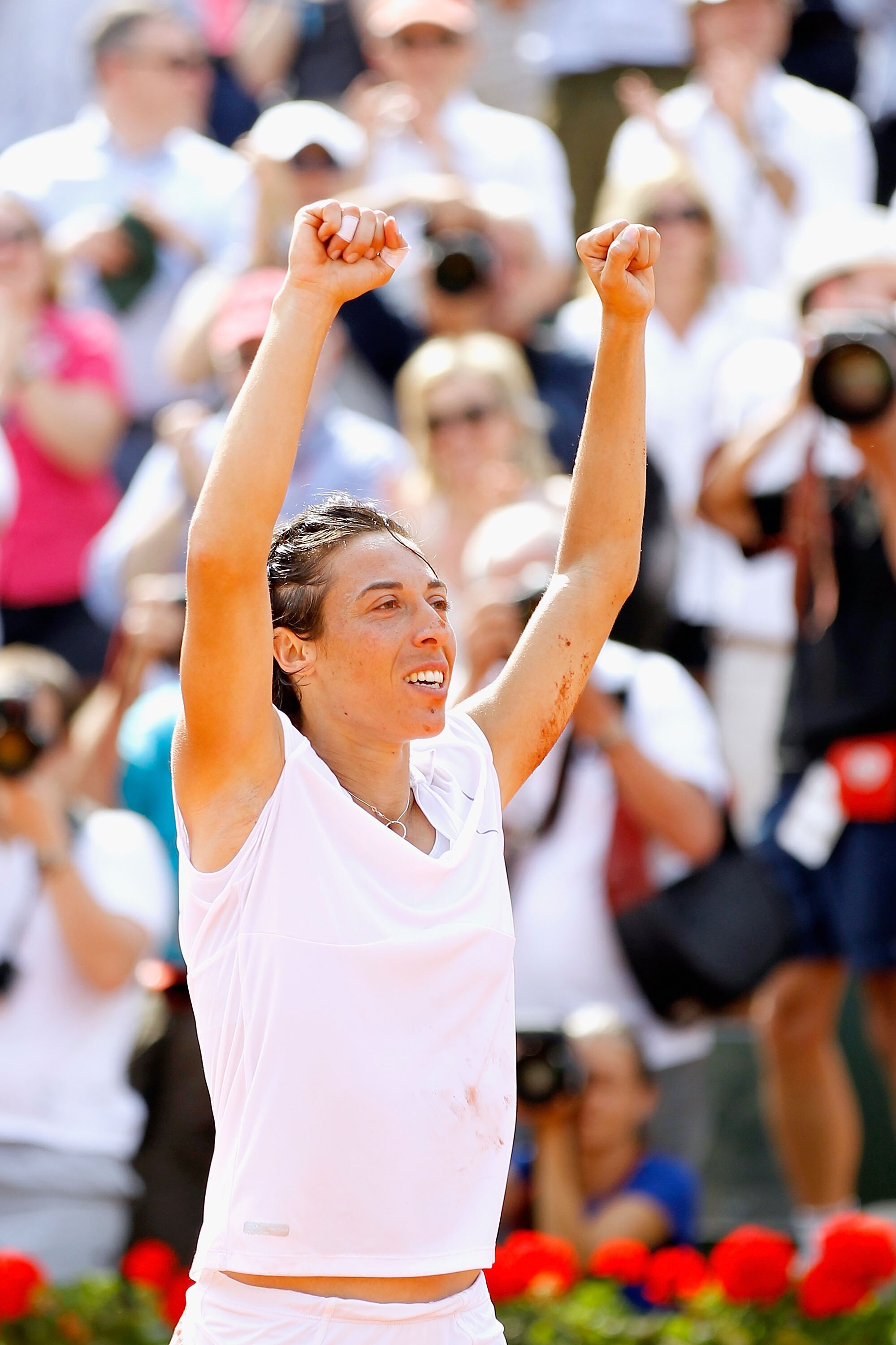 PARIS - JUNE 05:  Francesca Schiavone of Italy celebrates winning championship point during women's singles final match between Francesca Schiavone of Italy and Samantha Stosur of Australia on day fourteen of the French Open at Roland Garros on June 5, 20