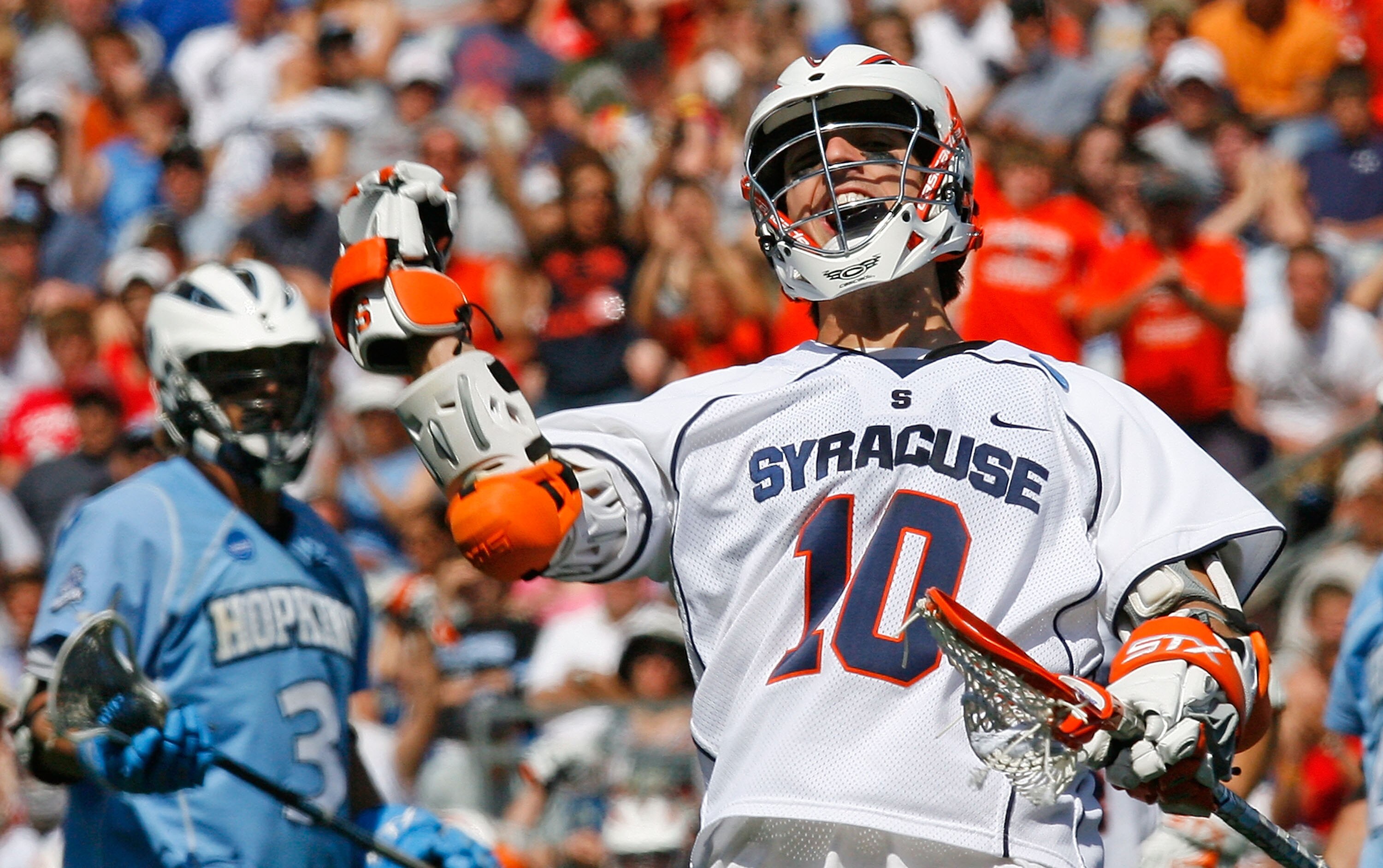 FOXBORO, MA - MAY 26:  Kenny Kims #10 of the Syracuse Orange reacts after scoring as Andrew Miller #3 of the Johns Hopkins Blue Jays looks on during the NCAA Lacrosse Championship at Gillette Stadium on May 26, 2008 in Foxboro, Massachusetts. Syracuse cap