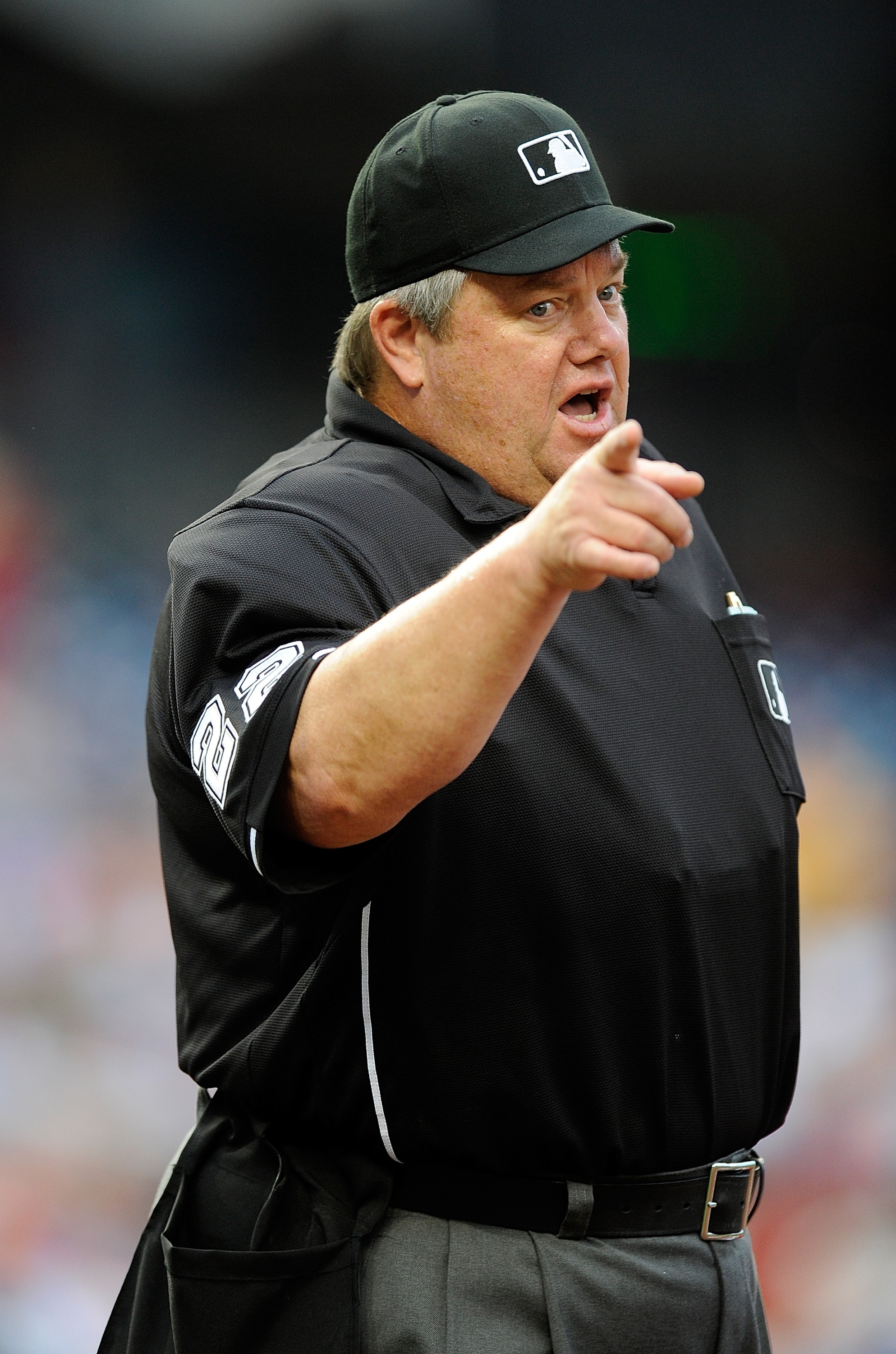 WASHINGTON - JUNE 05:  Home plate umpire Joe West motions to the Nationals bench during the game between the Cincinnati Reds and the Washington Nationals at Nationals Park on June 5, 2010 in Washington, DC.  (Photo by Greg Fiume/Getty Images)