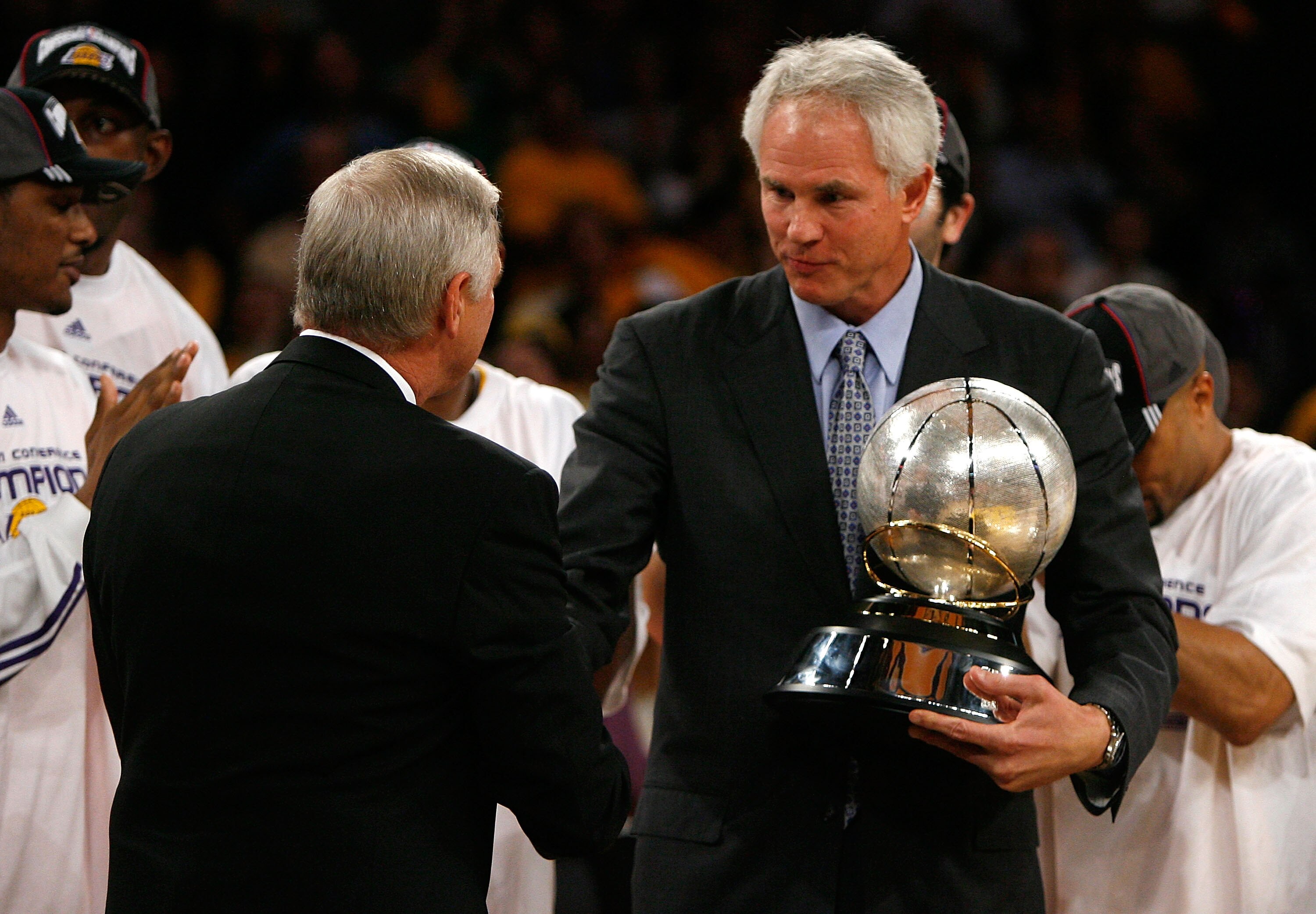 LOS ANGELES, CA - MAY 29:  (L-R) NBA legend Jerry West shakes hands with Los Angeles Lakers general manager Mitch Kupchak after defeating the Lakers defeated the San Antonio Spurs 100-92 in Game Five of the Western Conference Finals during the 2008 NBA Pl