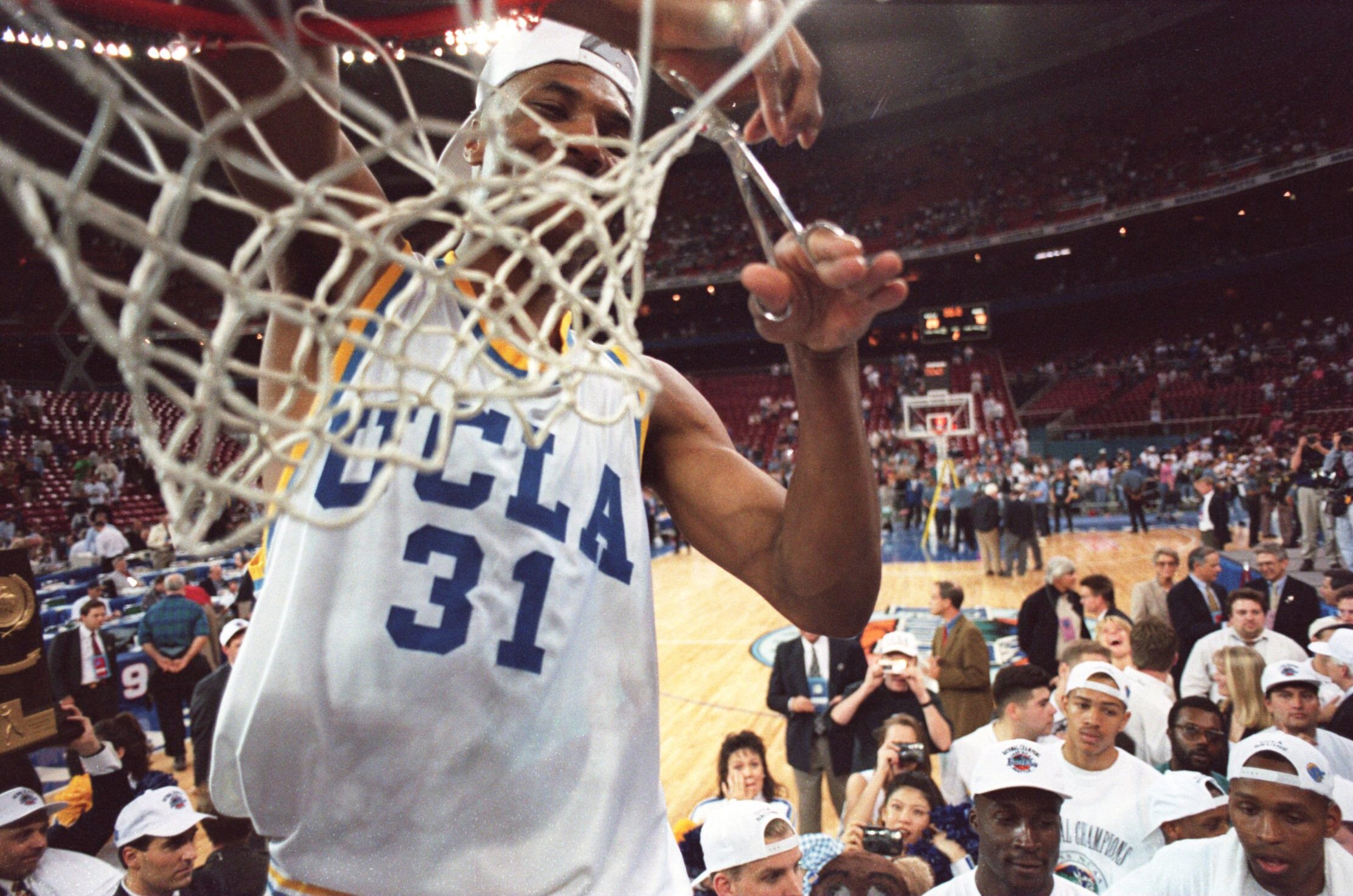 3 APR 1995:  UCLA FORWARD ED O''BANNON CUTS DOWN THE NET AFTER THEIR 89-78 VICTORY OVER ARKANSAS IN THE NCAA FINAL AT THE KINGDOME IN SEATTLE, WASHINGTON.  O''BANNON WAS NAMED PLAYER OF THE TOURNAMENT. Mandatory Credit: Allsport USA/ALLSPORT