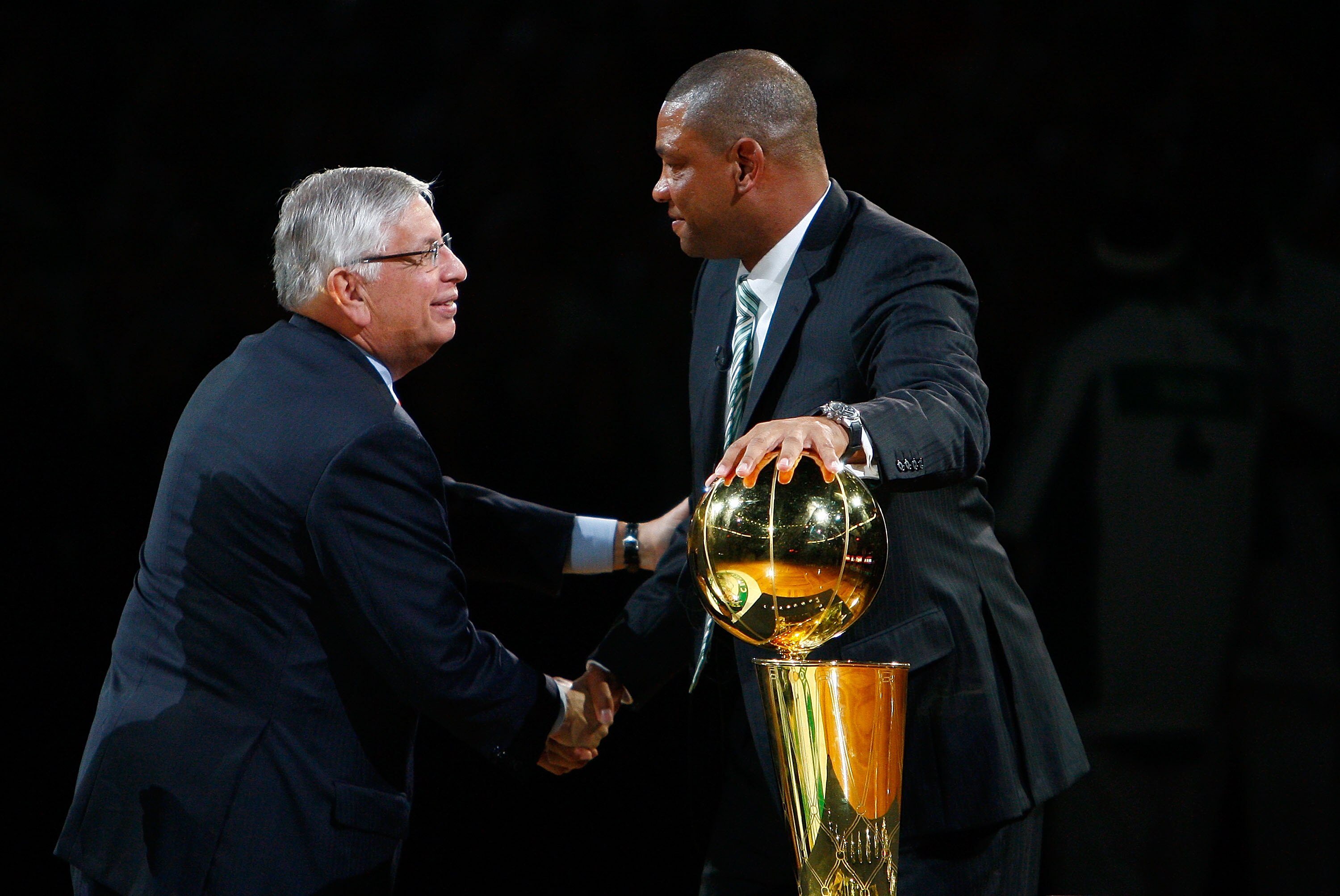 BOSTON, MA - OCTOBER 28: Coach Glenn 'Doc' Rivers of the Boston Celtics shakes hands with NBA Commissioner David Stern during the 2008 NBA World Championship ceremony before a game against the Cleveland Cavaliers at the TD Banknorth Garden on October 28,
