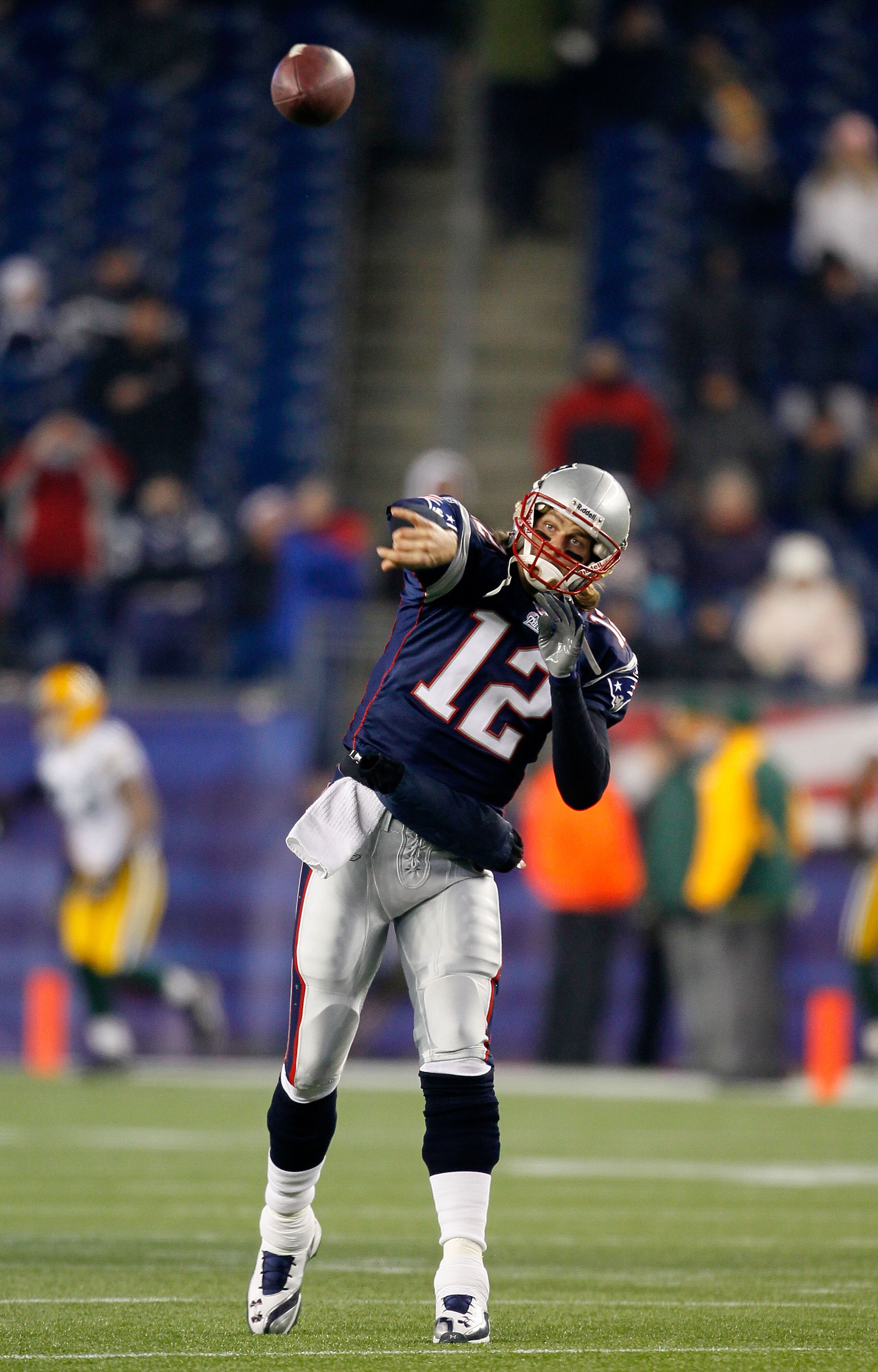 FOXBORO, MA - DECEMBER 19:  Quarterback Tom Brady #12 of the New England Patriots throws a pass during warm-ups before playing against the Green Bay Packers at Gillette Stadium on December 19, 2010 in Foxboro, Massachusetts.  (Photo by Jim Rogash/Getty Im