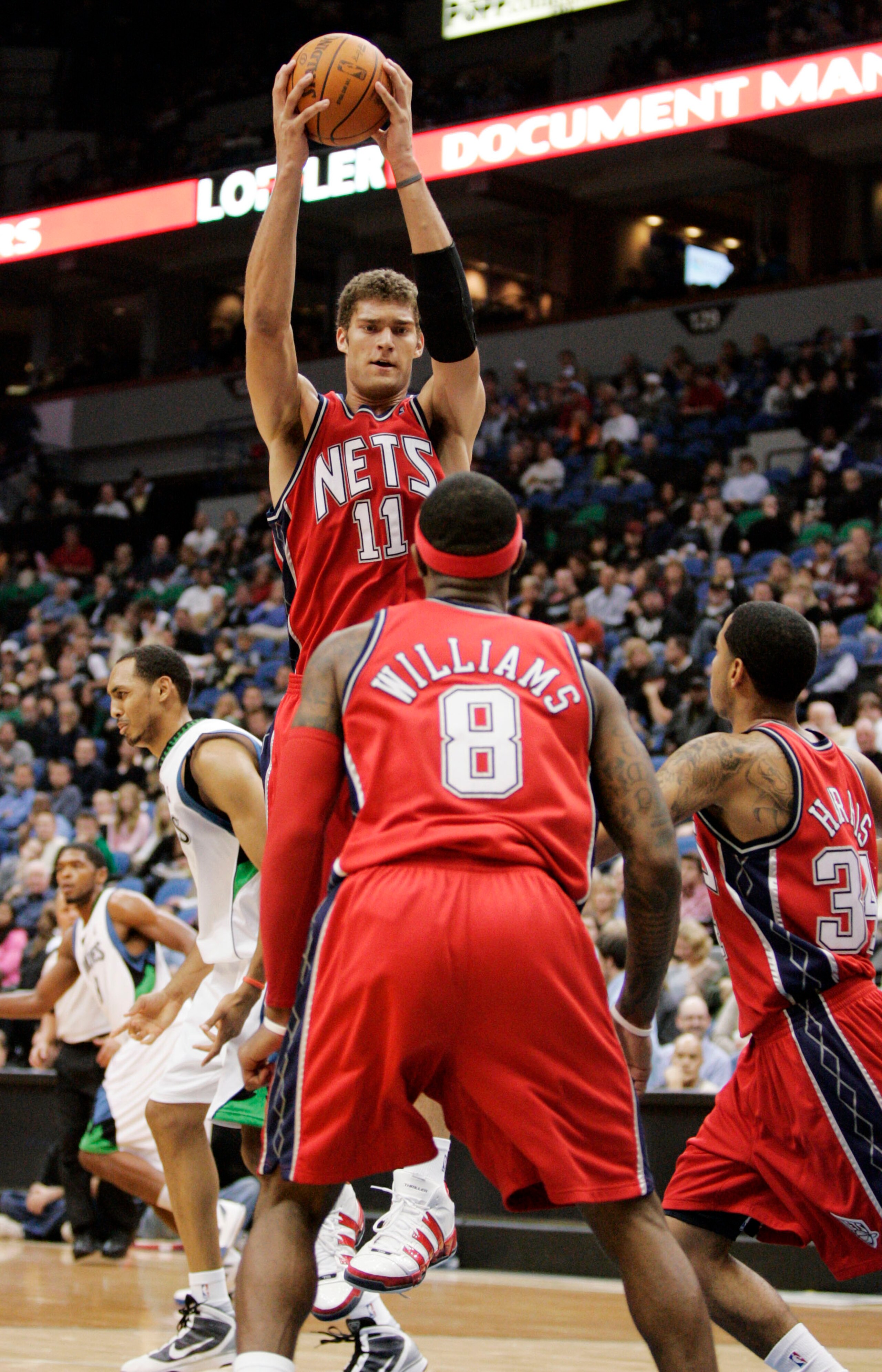 MINNEAPOLIS, MN - OCTOBER 28: Brook Lopez #11 of the New Jersey Nets pulls down a rebound against the Minnesota Timberwolves in the second quarter at the Target Center on October 28, 2009 in Minneapolis, Minnesota. (Photo by Genevieve Ross/Getty Images) MINNEAPOLIS, MN - OCTOBER 28: Brook Lopez #11 of the New Jersey Nets pulls down a rebound against the Minnesota Timberwolves in the second quarter at the Target Center on October 28, 2009 in Minneapolis, Minnesota. (Photo by Genevieve Ross/Getty Images)