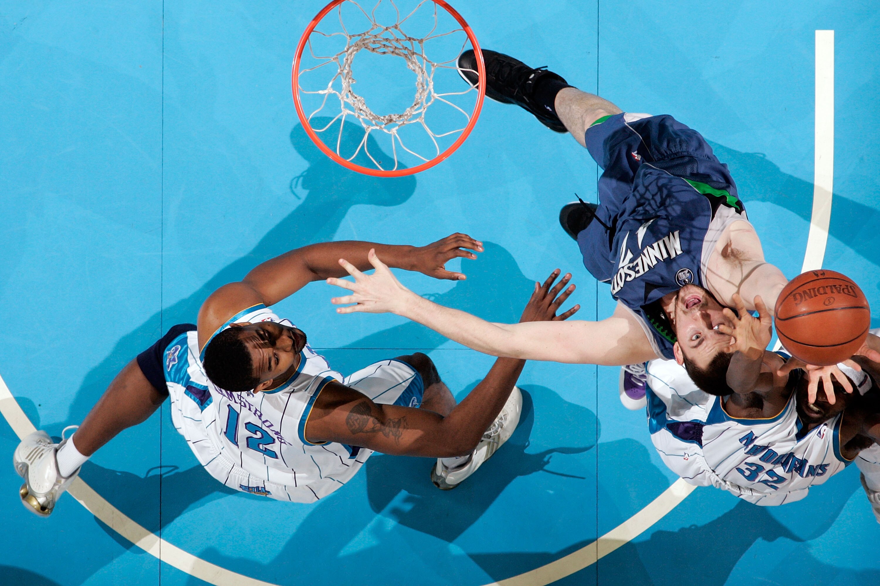 NEW ORLEANS - FEBRUARY 08:  Kevin Love #42 of the Minnesota Timberwolves fights for a rebound with Julian Wright #32  of the New Orleans Hornets on February 8, 2009 in New Orleans, Louisiana.  The Hornets defeated the Timberwolves 101-97.  NOTE TO USER: U