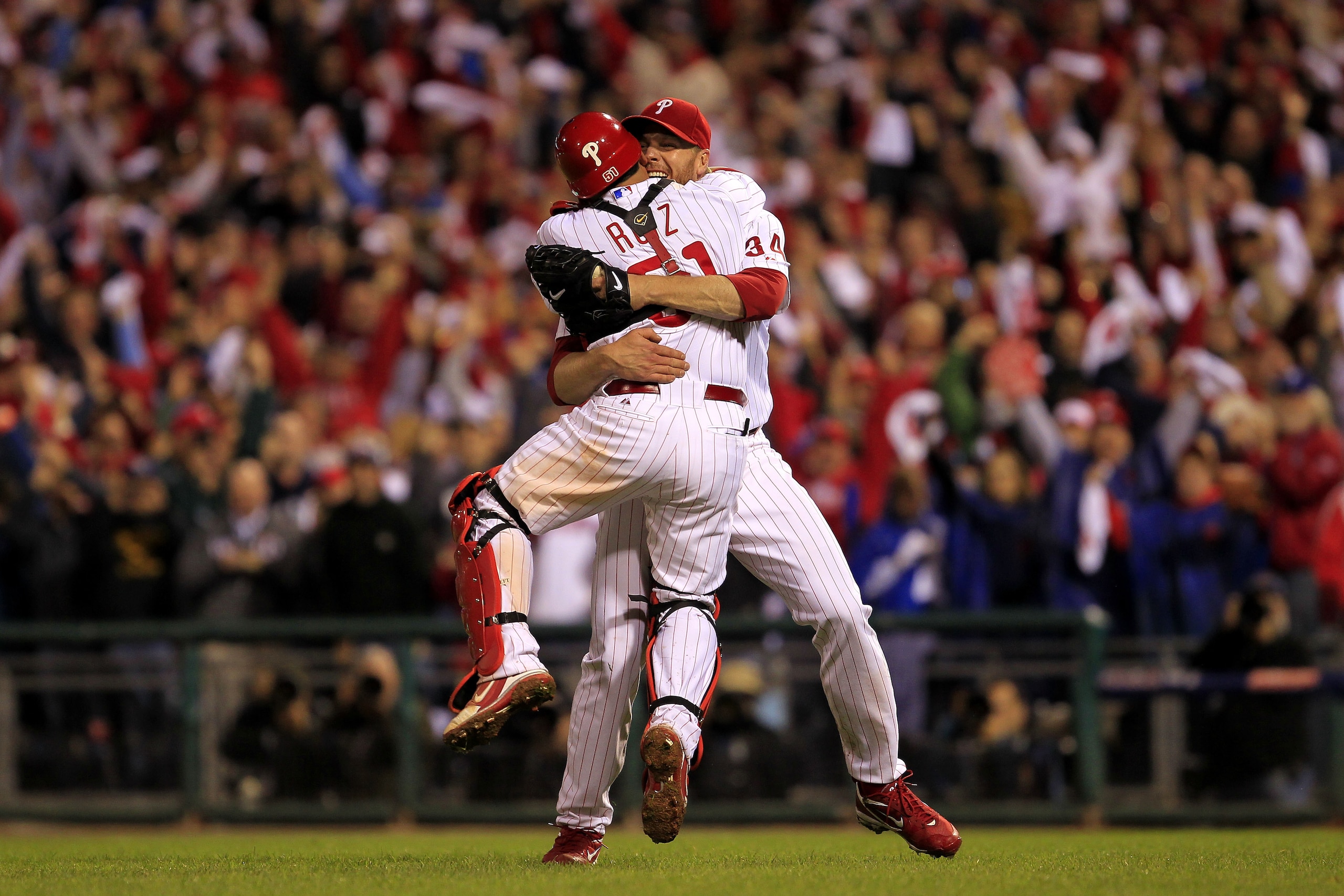 PHILADELPHIA - OCTOBER 06:  Roy Halladay #34 and Carlos Ruiz #51 of the Philadelphia Phillies celebrate Halladay's no-hitter and the win in Game 1 of the NLDS against the Cincinnati Reds at Citizens Bank Park on October 6, 2010 in Philadelphia, Pennsylvan