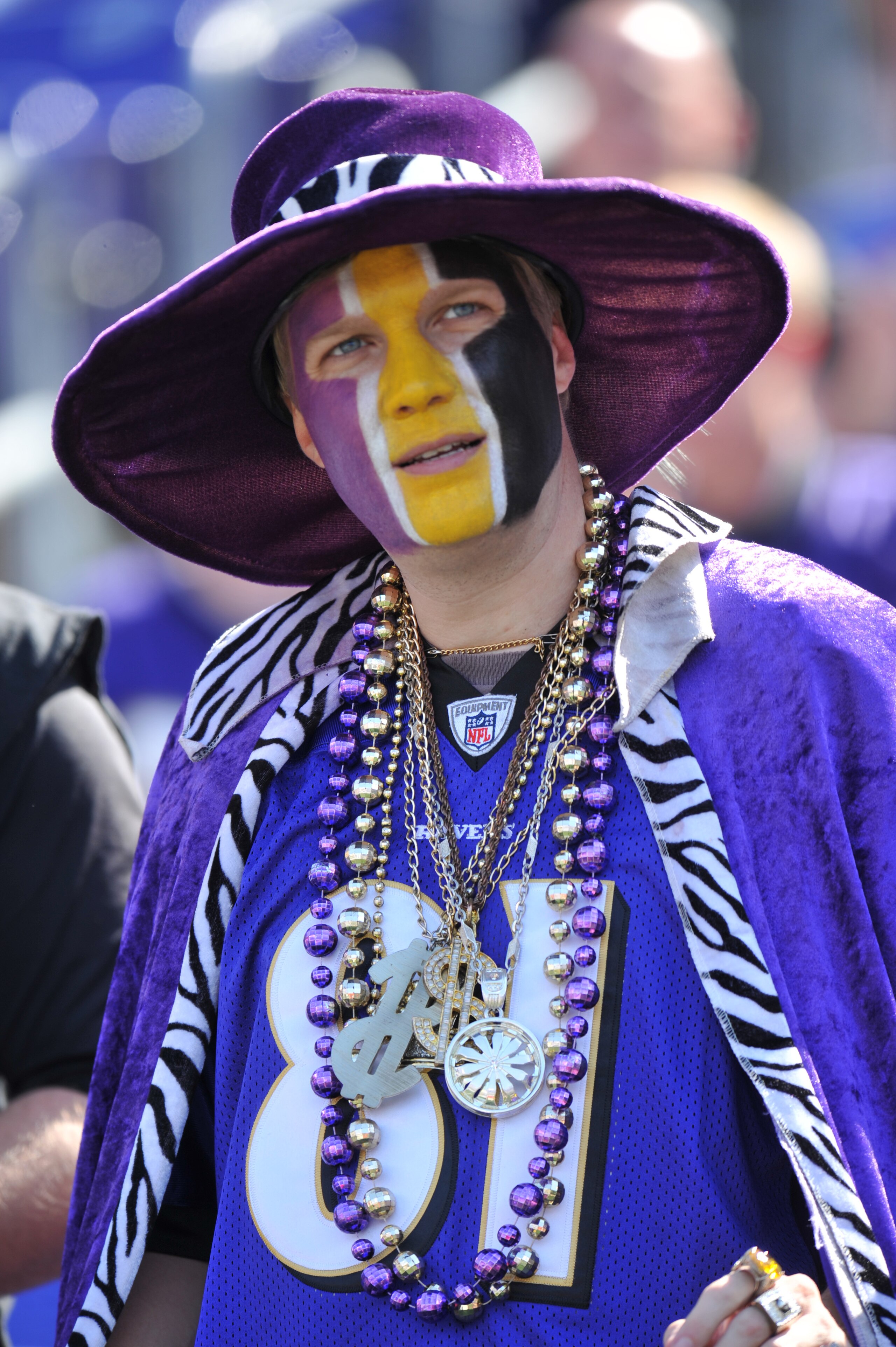 BALTIMORE, MD - OCTOBER 10: A fan of the Baltimore Ravens watches the action against the Denver Broncos at M&T Bank Stadium on October 10, 2010 in Baltimore, Maryland. Players wore pink in recognition of Breast Cancer Awareness Month. The Ravens defeated