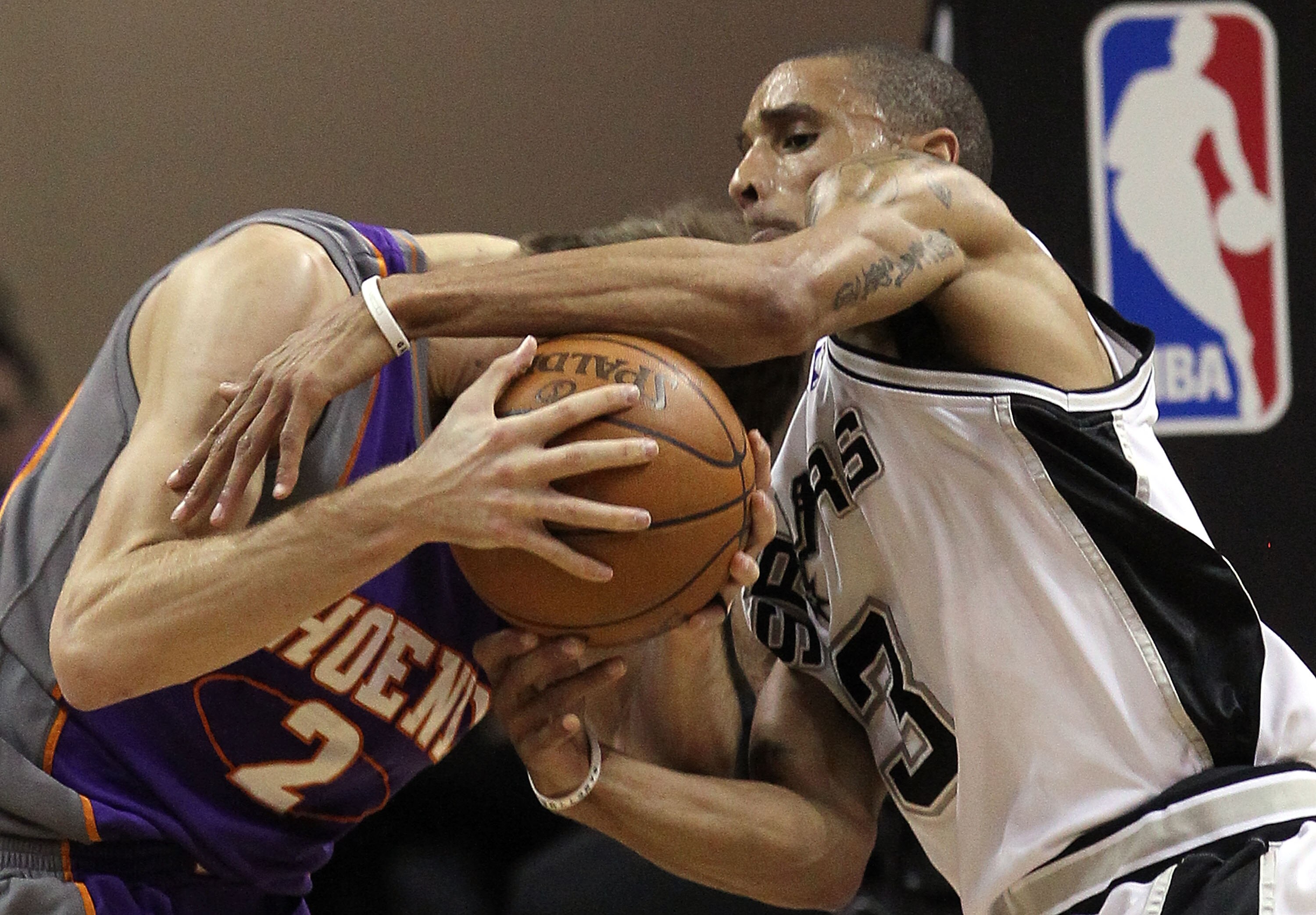 SAN ANTONIO - MAY 09:  Guard George Hill #3 of the San Antonio Spurs reaches for the ball against Goran Dragic #2 of the Phoenix Suns in Game Four of the Western Conference Semifinals during the 2010 NBA Playoffs at AT&T Center on May 9, 2010 in San Anton