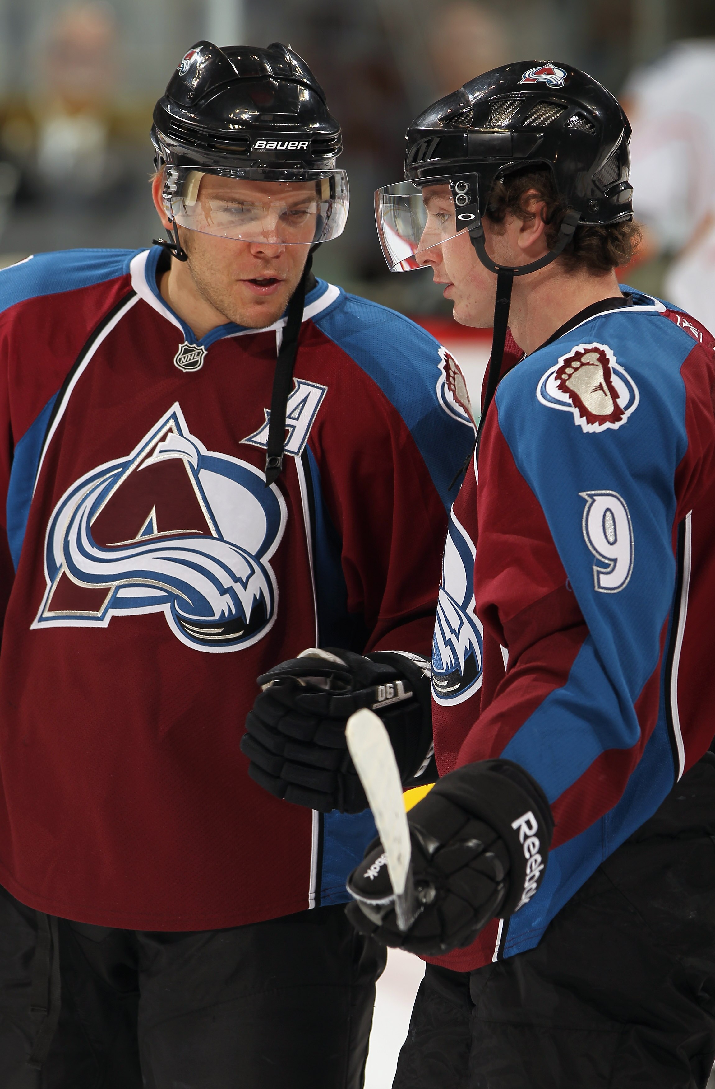 DENVER - NOVEMBER 09:  Paul Stastny #26 and Matt Duchene #9 of the Colorado Avalanche talk during warm ups prior to facing the Calgary Flames at Pepsi Center on November 9, 2010 in Denver, Colorado.  (Photo by Doug Pensinger/Getty Images)