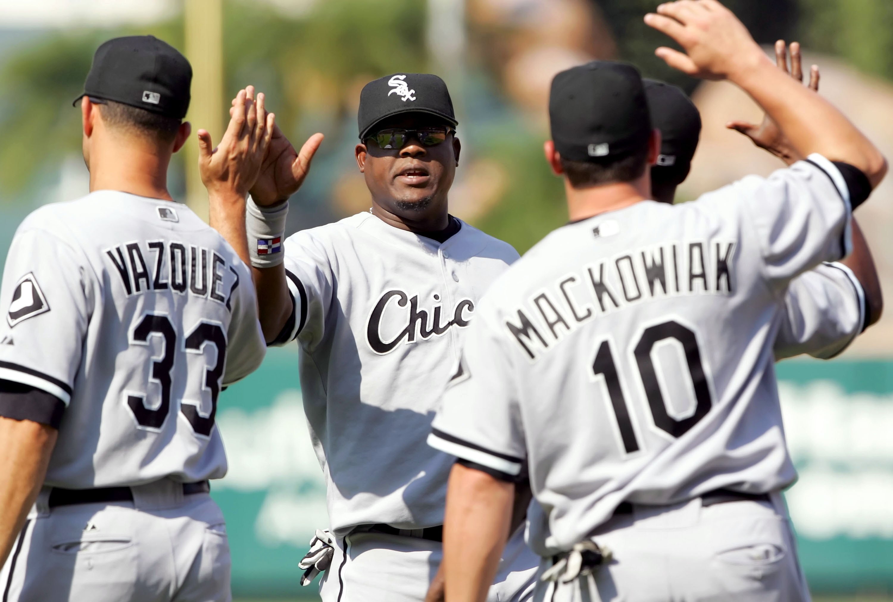 ANAHEIM, CA - SEPTEMBER 13:  Juan Uribe #5 of the Chicago White Sox celebrates with his teammates after defeating the Los Angeles Angels of Anaheim on September 13, 2006 at Angel Stadium in Anaheim, California. The White Sox defeated the Angels 9-0.  (Pho
