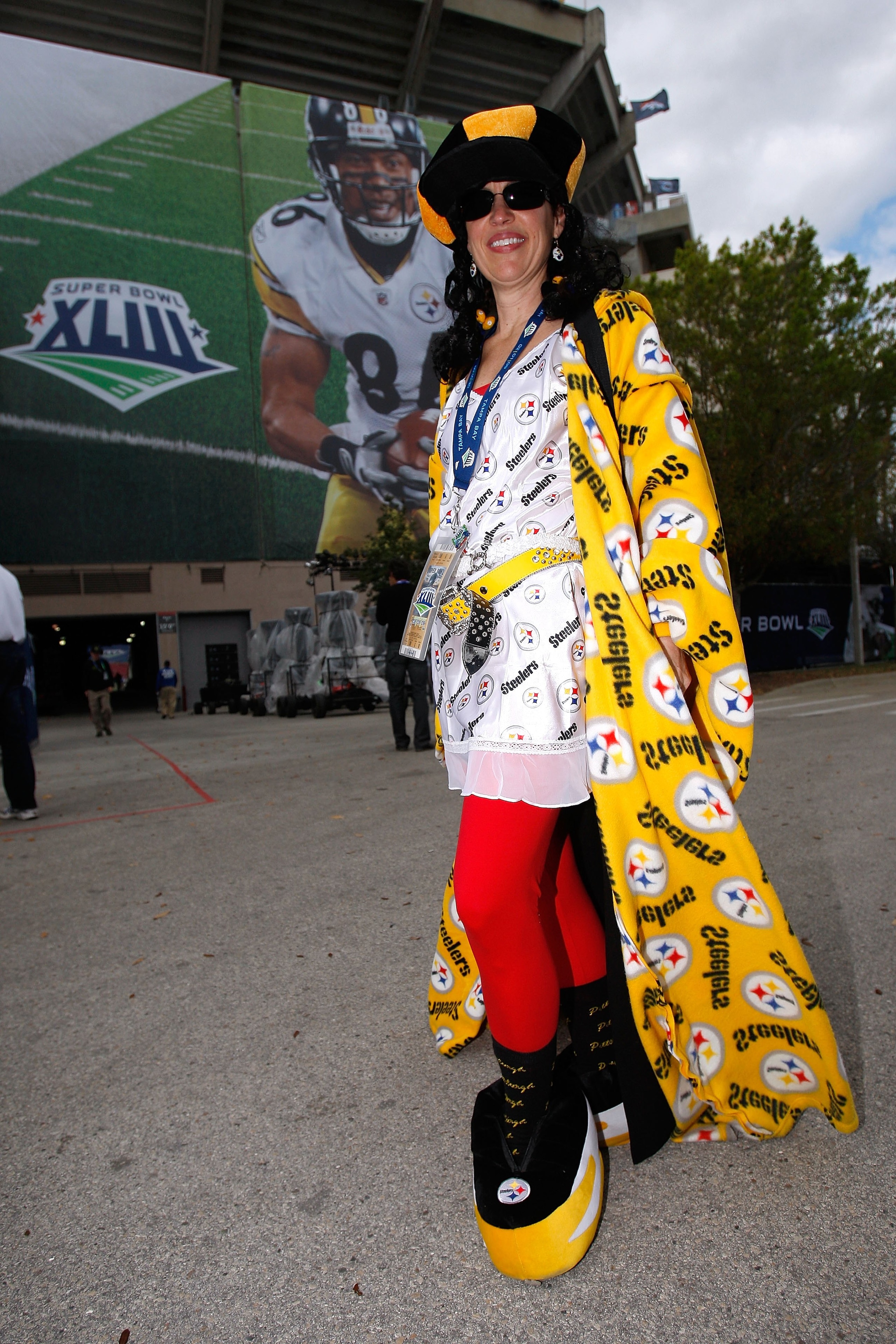 TAMPA, FL - FEBRUARY 01:  Pittsburgh Steelers fan, Trisha Simmons from Los Angeles, CA, shows support for her team as she poses in front of signage with the likeness of Hines Ward #86 on it prior to Super Bowl XLIII against the Arizona Cardinals on Februa