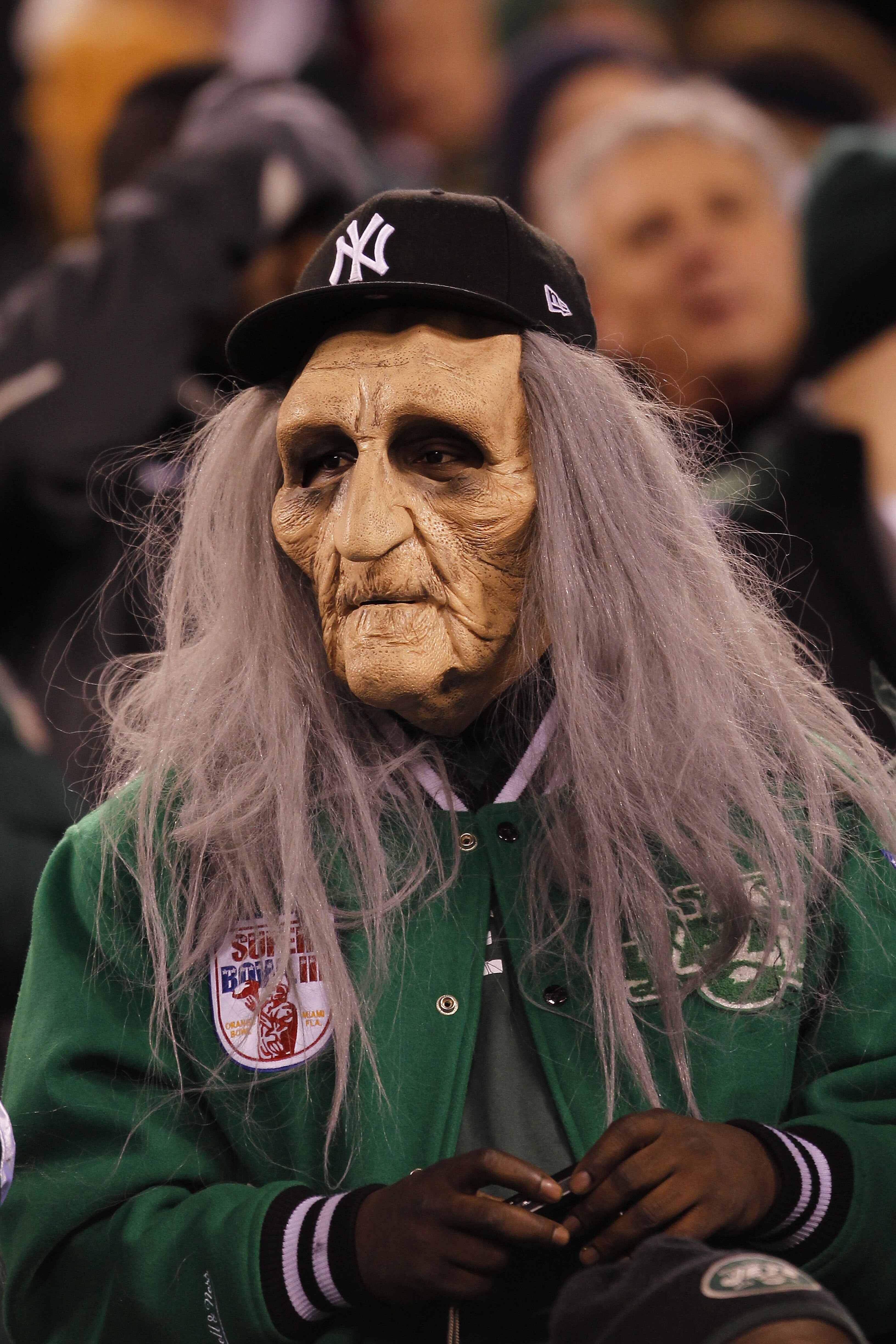 EAST RUTHERFORD, NJ - NOVEMBER 25:  A New York Jets fan watches the game against the Cincinnati Bengals at New Meadowlands Stadium on November 25, 2010 in East Rutherford, New Jersey. The Jets defeated the Bengal 26-10.  (Photo by Chris Trotman/Getty Imag