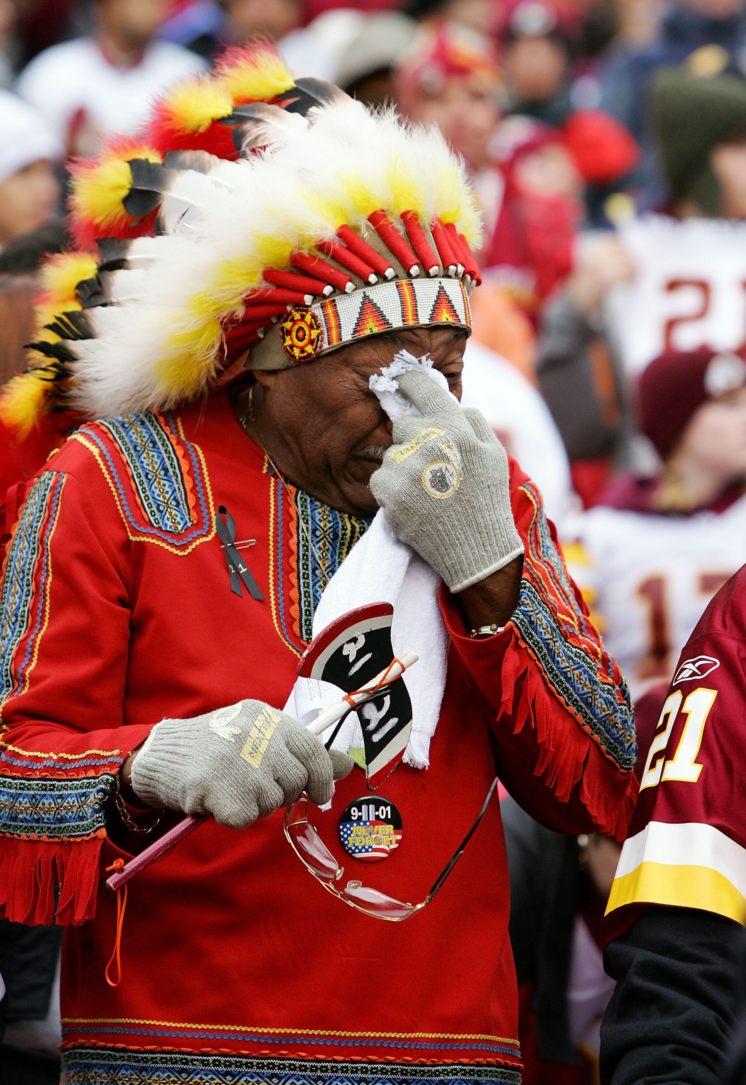 LANDOVER, MD - DECEMBER 02:  Washington Redskins fan 'Chief Zee' fights back tears during a pre game ceremony honoring the late Sean Taylor before the game against the Buffalo Bills on December 2, 2007 at FedEx Field in Landover, Maryland.  (Photo by Jim