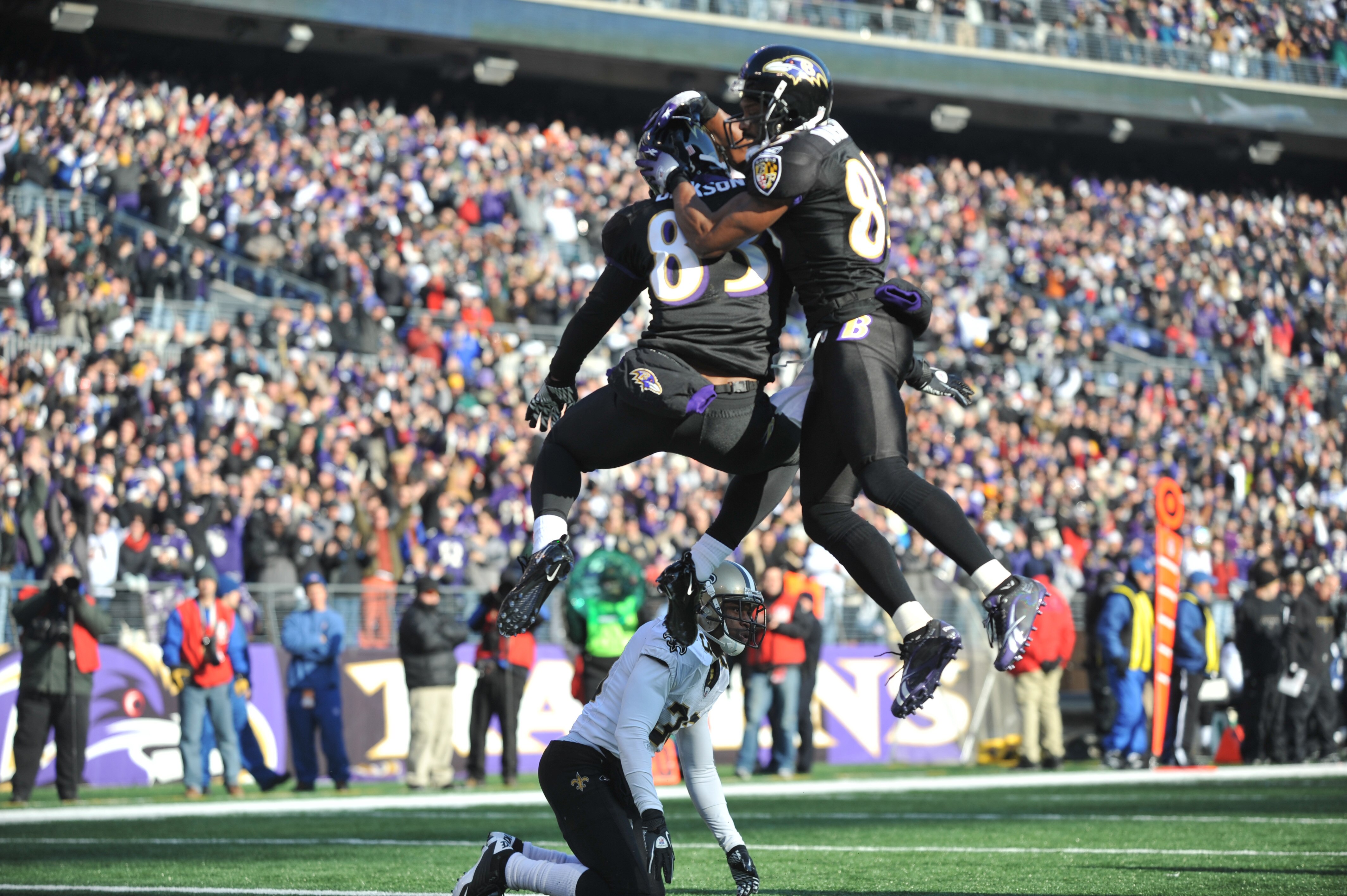 BALTIMORE, MD - DECEMBER 19:  Ed Dickson #83 of the Baltimore Ravens celebrates his first quarter touchdown against the New Orleans Saints  at M&T Bank Stadium on December 19, 2010 in Baltimore, Maryland. The Ravens defeated the Saints 30-24. (Photo by La