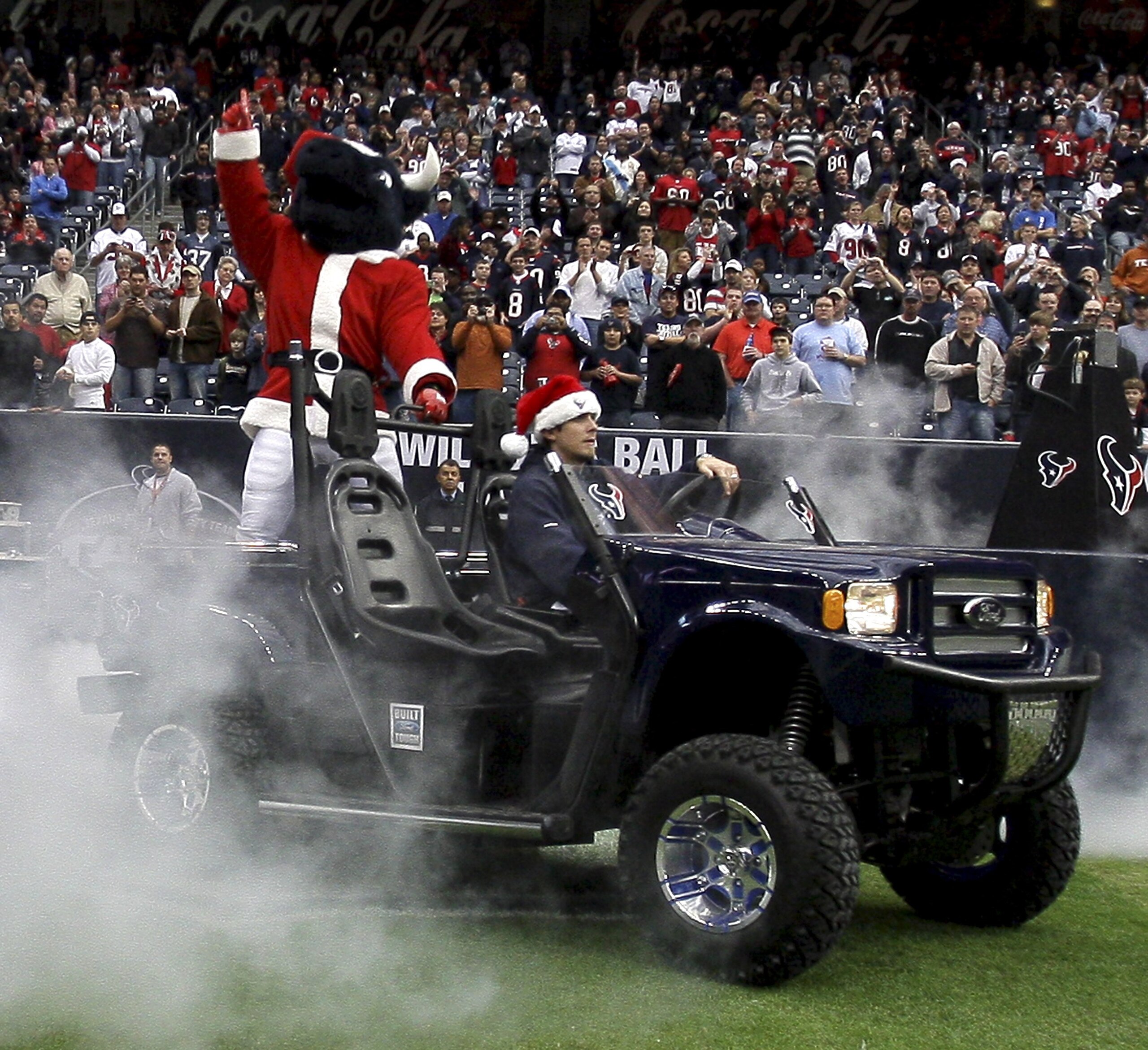 HOUSTON - DECEMBER 13:  Houston Texans mascot Toro enters the field in a Santa Claus suit before the game against the Seattle Seahawks at Reliant Stadium on December 13, 2009 in Houston, Texas.  (Photo by Bob Levey/Getty Images)