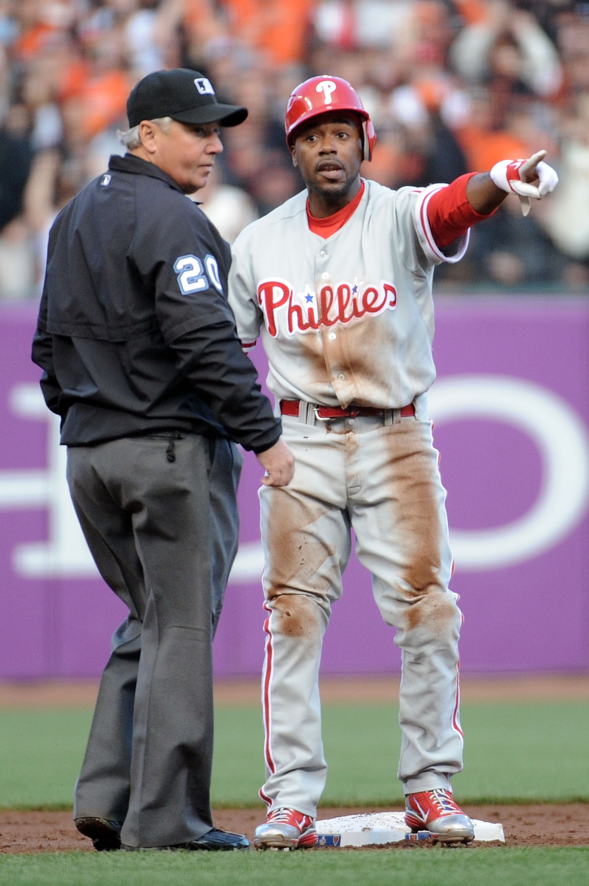 SAN FRANCISCO - OCTOBER 20:  Jimmy Rollins #11 of the Philadelphia Phillies argues with umpire Tom Hallion at second base after being tagged out during Game Four of the NLCS against the San Francisco Giants in the 2010 MLB Playoffs at AT&T Park on October