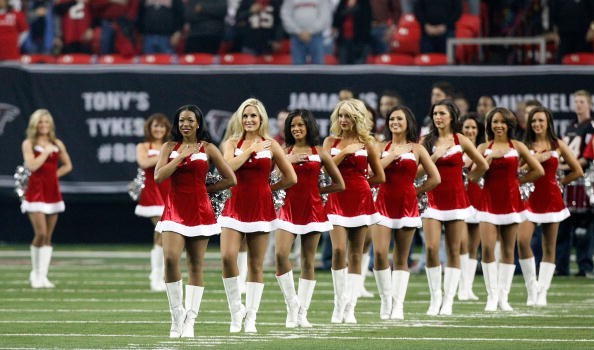 ATLANTA - DECEMBER 13:  The Atlanta Falcons cheerleaders stand during the National Anthem wearing Christmas outfits before the game against the New Orleans Saints at Georgia Dome on December 13, 2009 in Atlanta, Georgia.  (Photo by Kevin C. Cox/Getty Imag