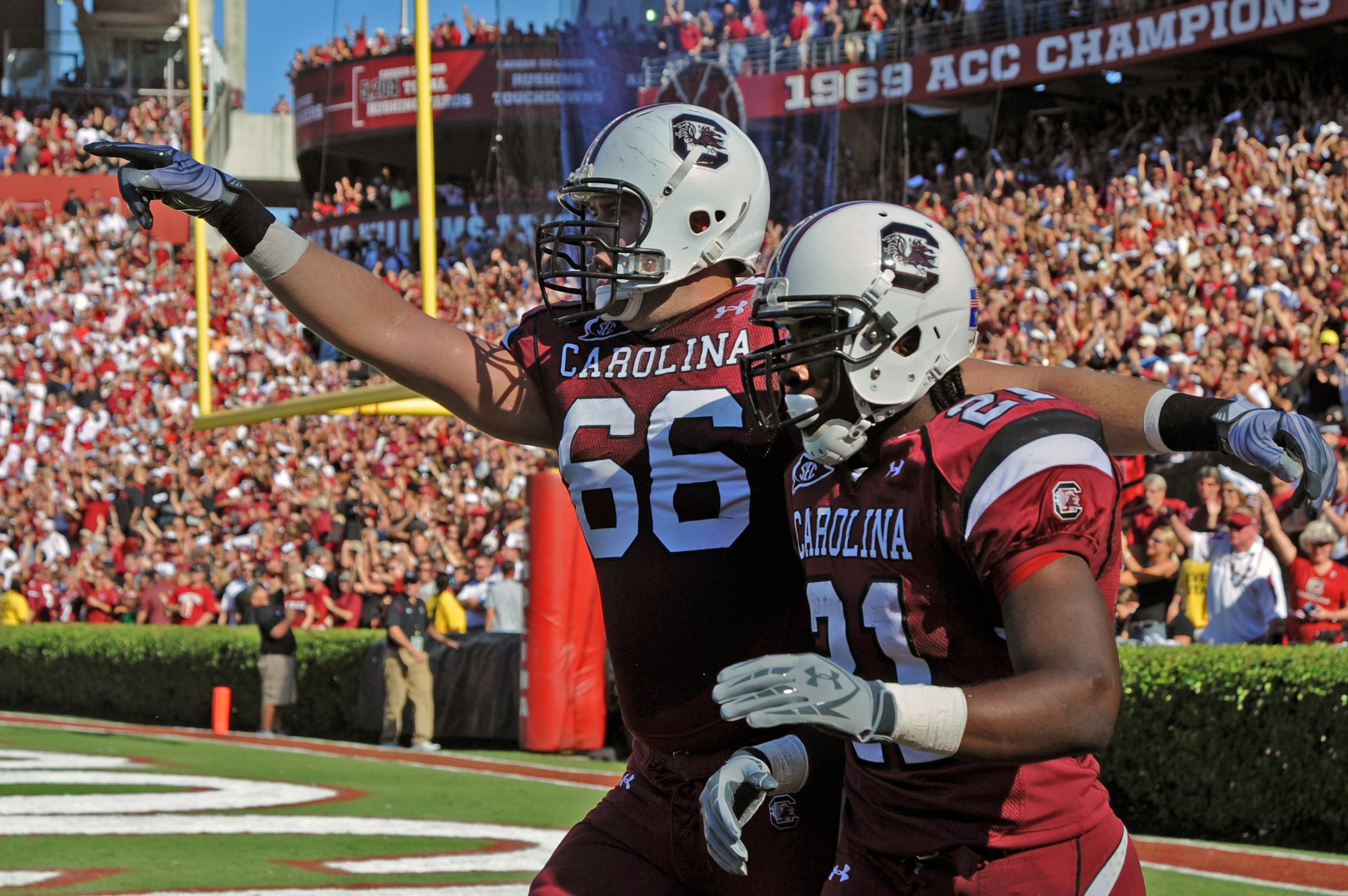 COLUMBIA, SC - OCTOBER 9: Running back Marcus Lattimore #21 of the South Carolina Gamecocks celebrates a touchdown run with tackle Hutch Eckerson #66 against the Alabama Crimson Tide October 9, 2010 at Williams-Brice Stadium in Columbia, South Carolina.  