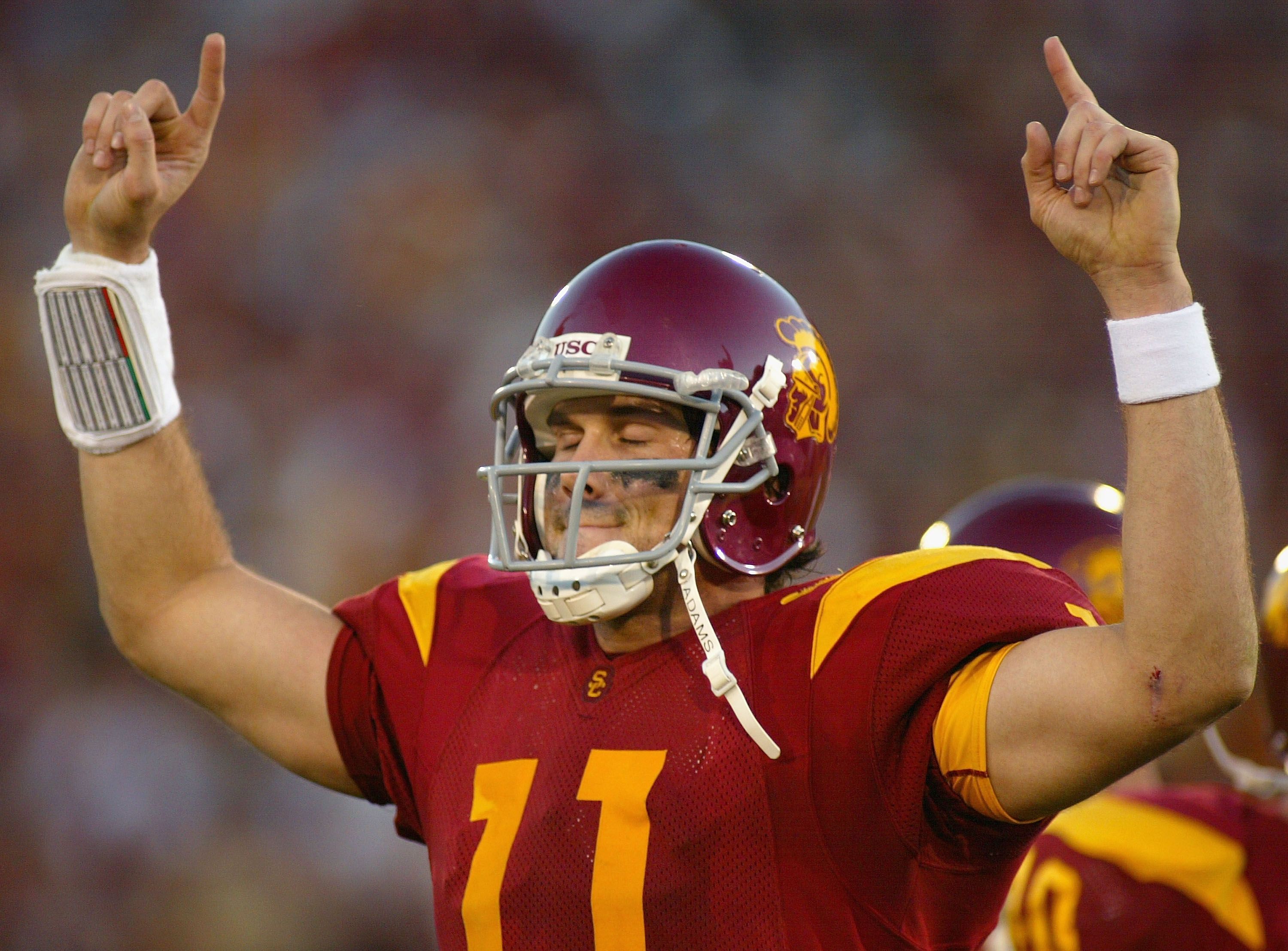 LOS ANGELES, CA - DECEMBER 03:  Quaterback Matt Leinart #11 of the USC Trojans reacts to the crowd after leaving his final home game against the UCLA Bruins on December 3, 2005 at the Los Angeles Memorial Coliseum in Los Angeles, California. USC won 66-19