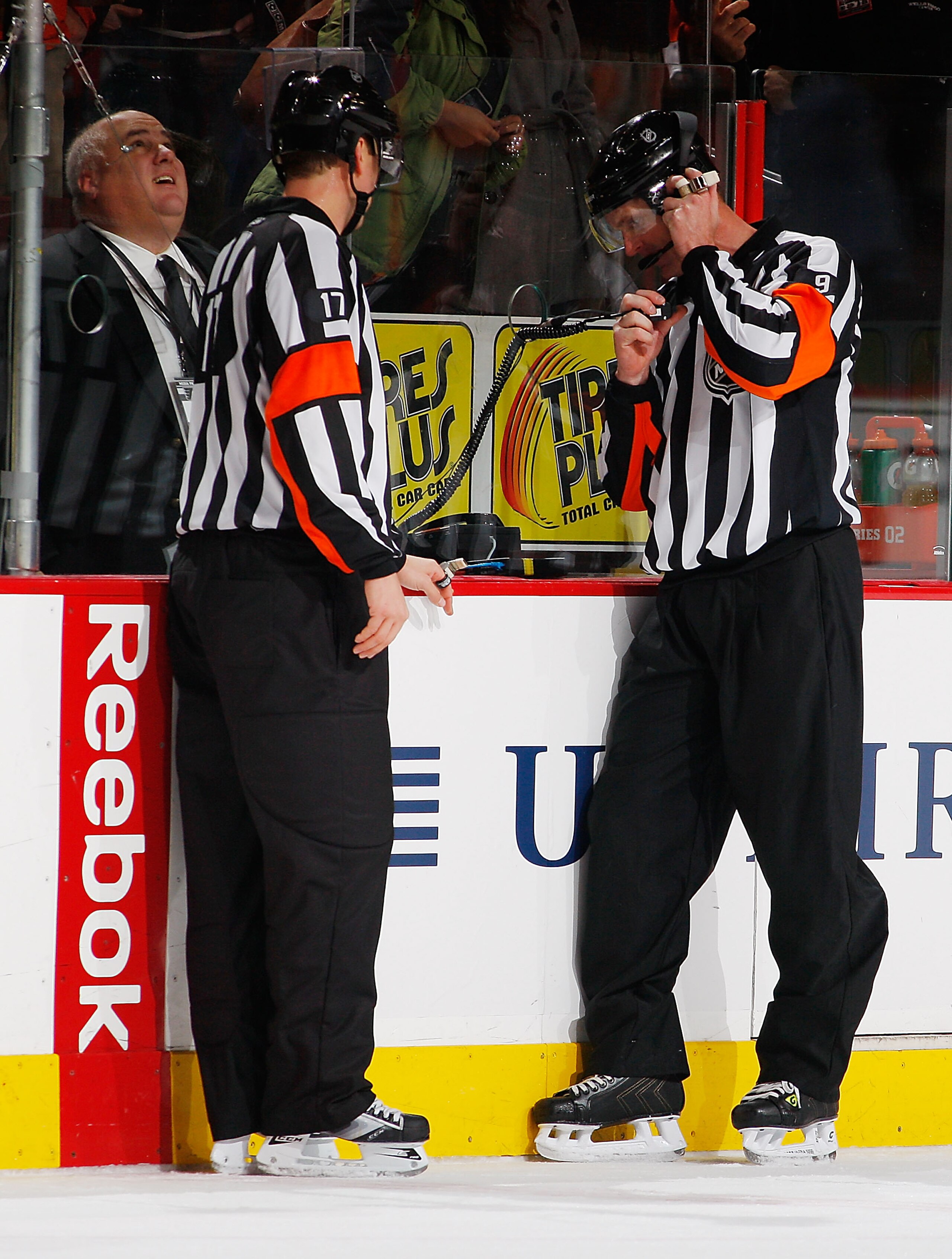 PHILADELPHIA - DECEMBER 08:  Referee Dan O'Rourke #9 reviews Mike Richards #18 (not shown) of the Philadelphia Flyers overtime goal after a replay showed time expired an instant before the puck crossed the line and was waved off against the San Jose Shark