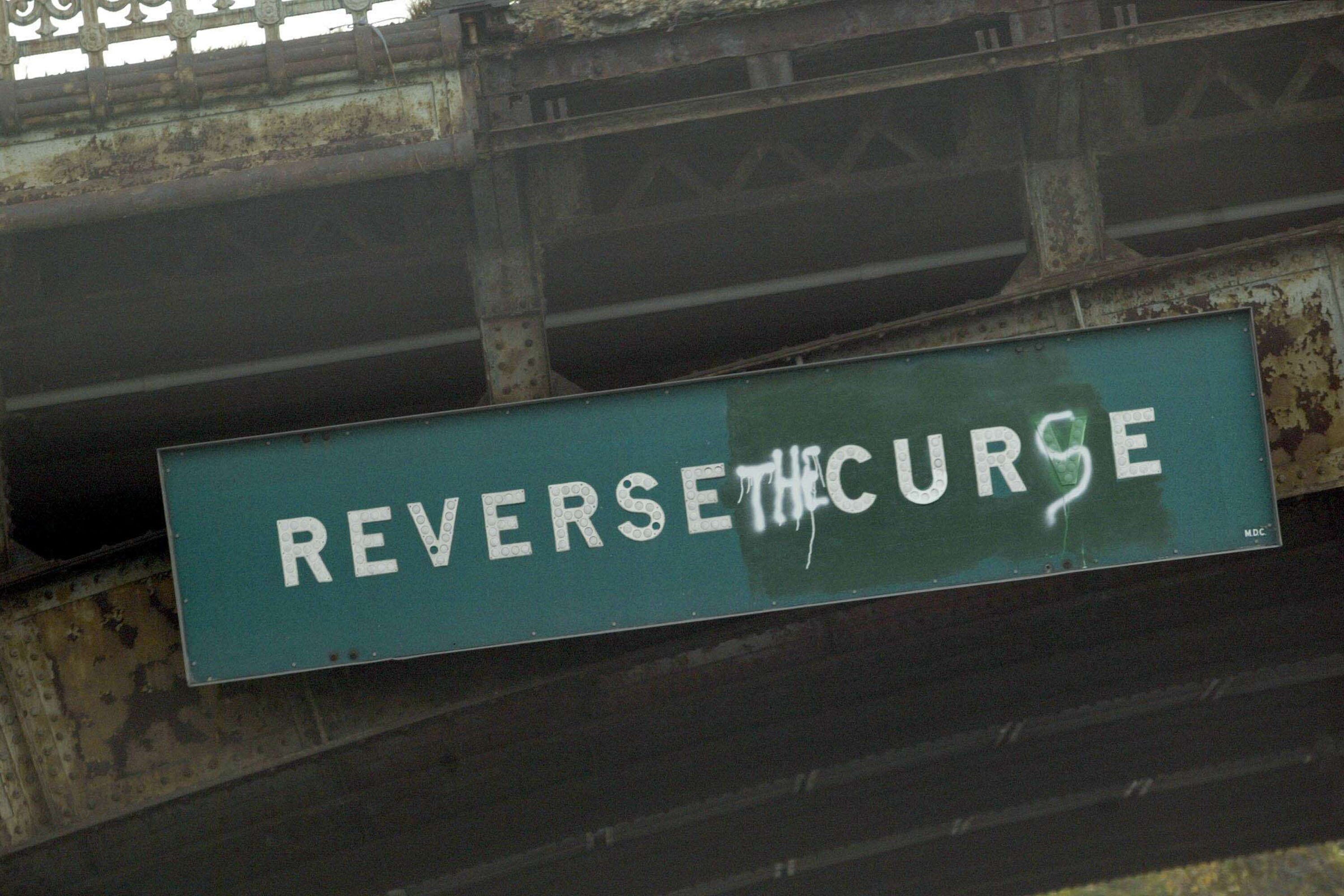 BOSTON - OCTOBER 14:  A sign on Storrow Drive in Boston reads, 'Reverse the Curse', before the start of the New York Yankees and the Boston Red Sox Game 5 of the 2003 American League Championship Series on October 14, 2003 at Fenway Park in Boston, Massac