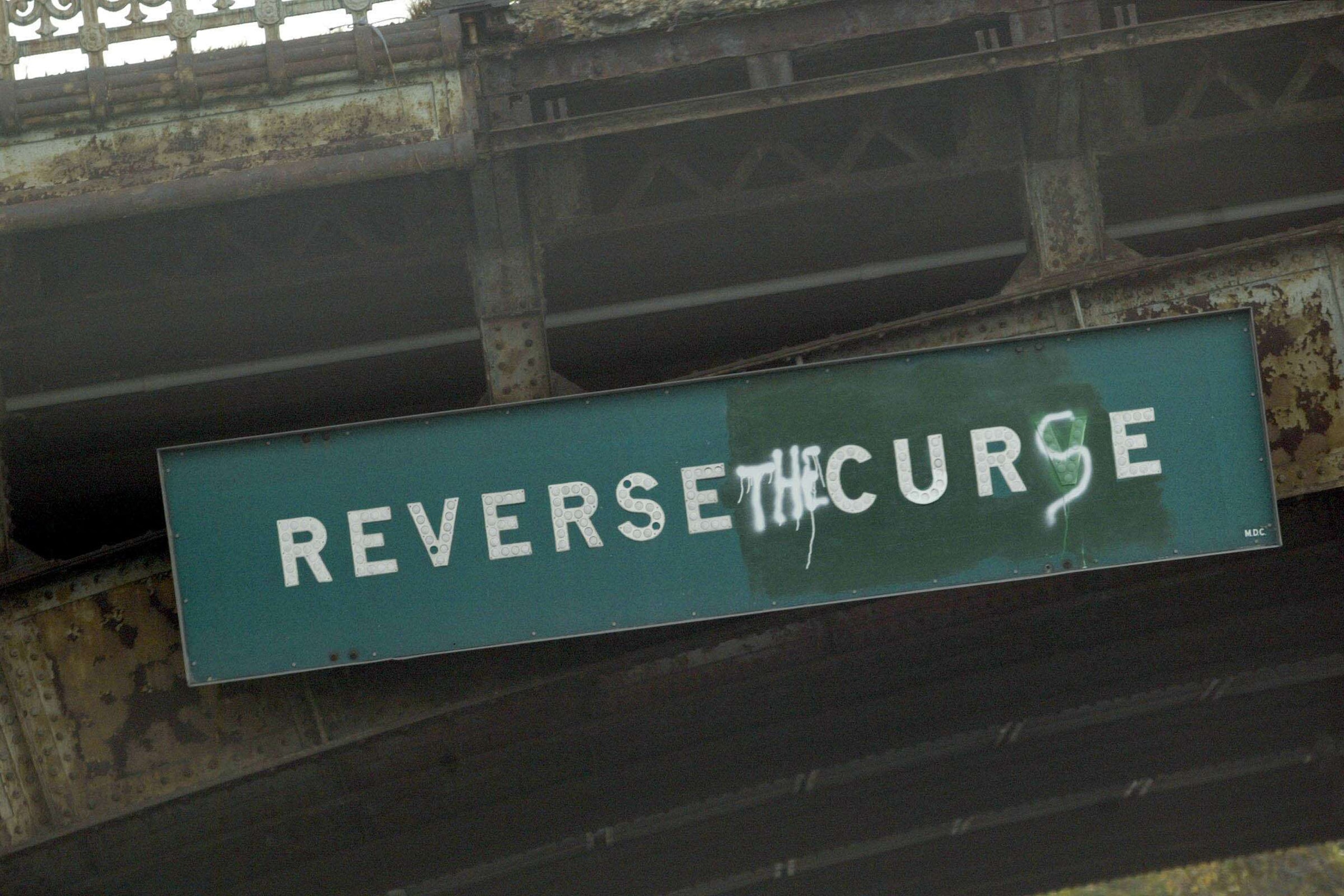 BOSTON - OCTOBER 14:  A sign on Storrow Drive in Boston reads, 'Reverse the Curse', before the start of the New York Yankees and the Boston Red Sox Game 5 of the 2003 American League Championship Series on October 14, 2003 at Fenway Park in Boston, Massac