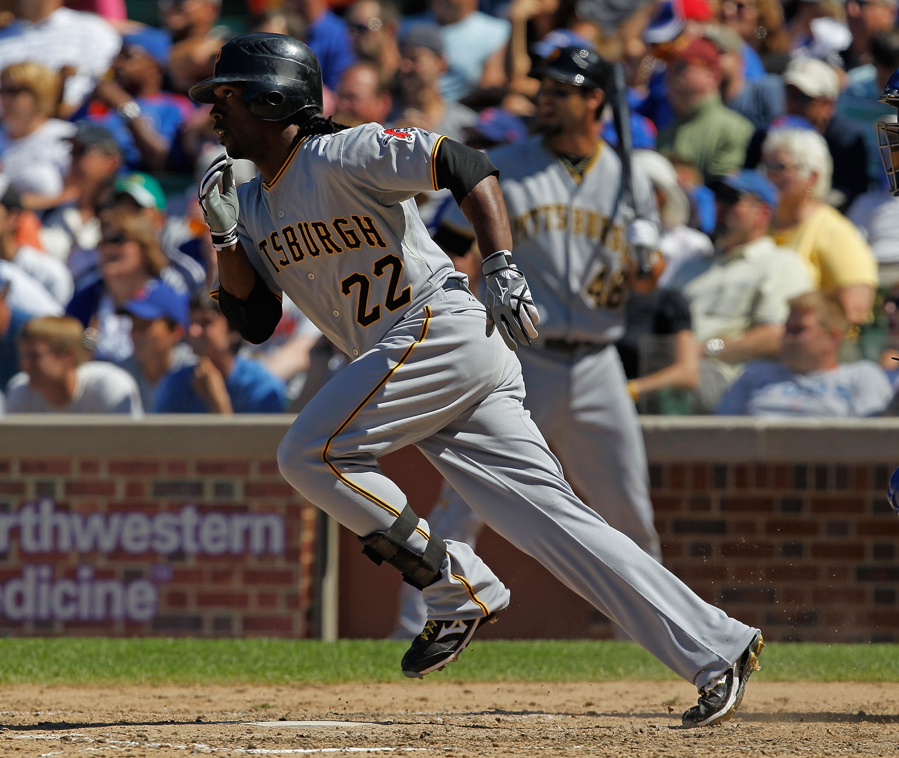 CHICAGO - JUNE 30: Andrew McCutchen #22 of the Pittsburgh Pirates runs to first base after hitting a single in the 8th inning against the Chicago Cubs at Wrigley Field on June 30, 2010 in Chicago, Illinois. The Pirates defeated the Cubs 2-0. (Photo by Jon