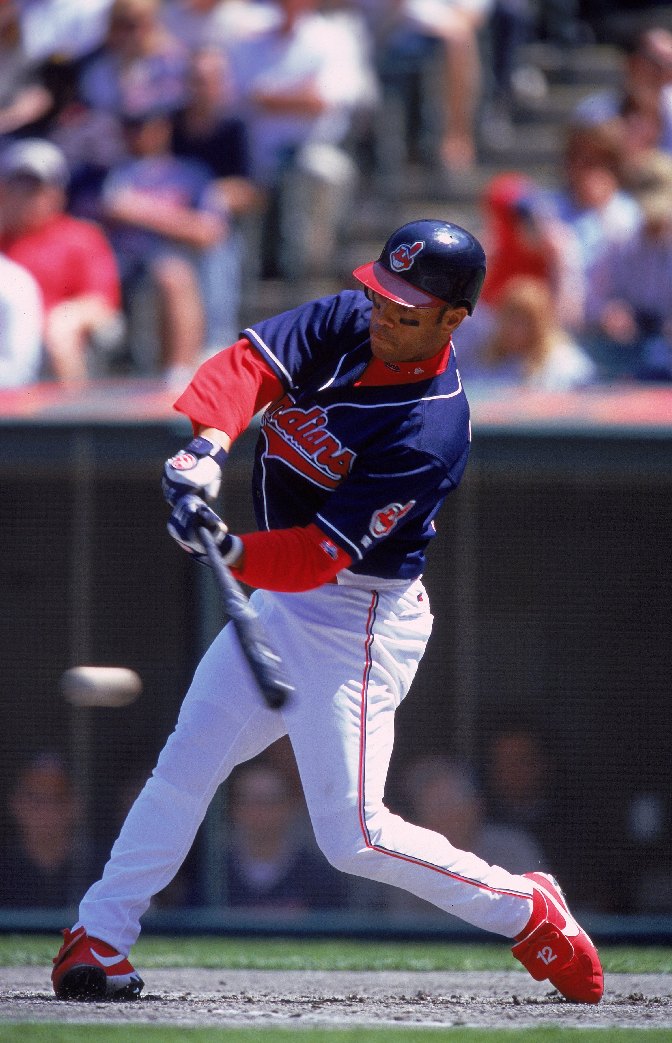 15 Apr 2000:  Roberto Alomar #12 of the Cleveland Indians swings to hit the ball during the game against the Texas Rangers at the Jacobs Field in Cleveland, Ohio. The Rangers defeated the Indians 6-4. Mandatory Credit: Harry How  /Allsport