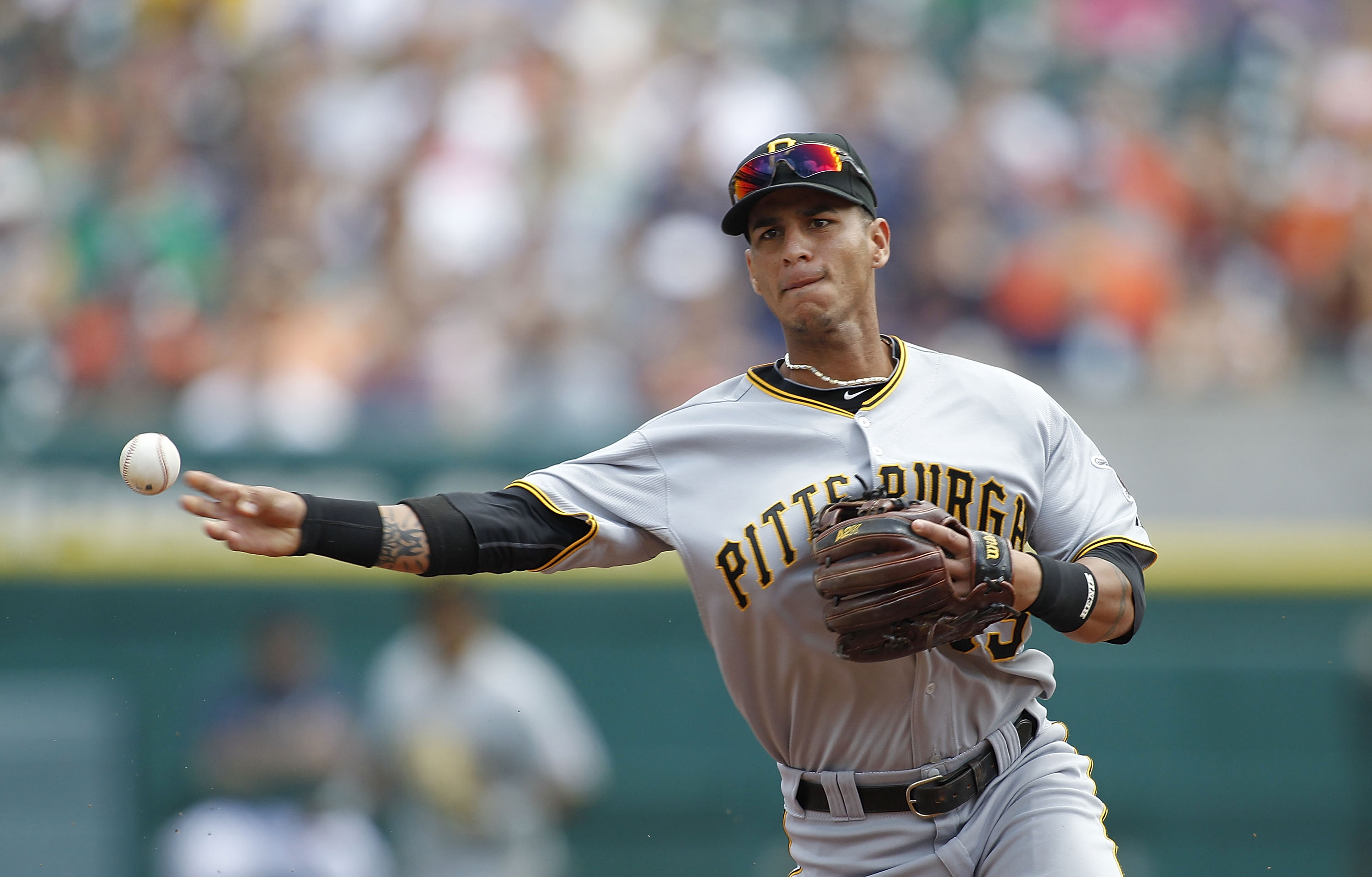 DETROIT - JUNE 13: Ronny Cedeno #13 of the Pittsburgh Pirates throws out Ryan Raburn #25 of the Detroit Tigers in the second inning during the game on June 13, 2010 at Comerica Park in Detroit, Michigan. The Tigers defeated the Pirates 4-3.  (Photo by Leo