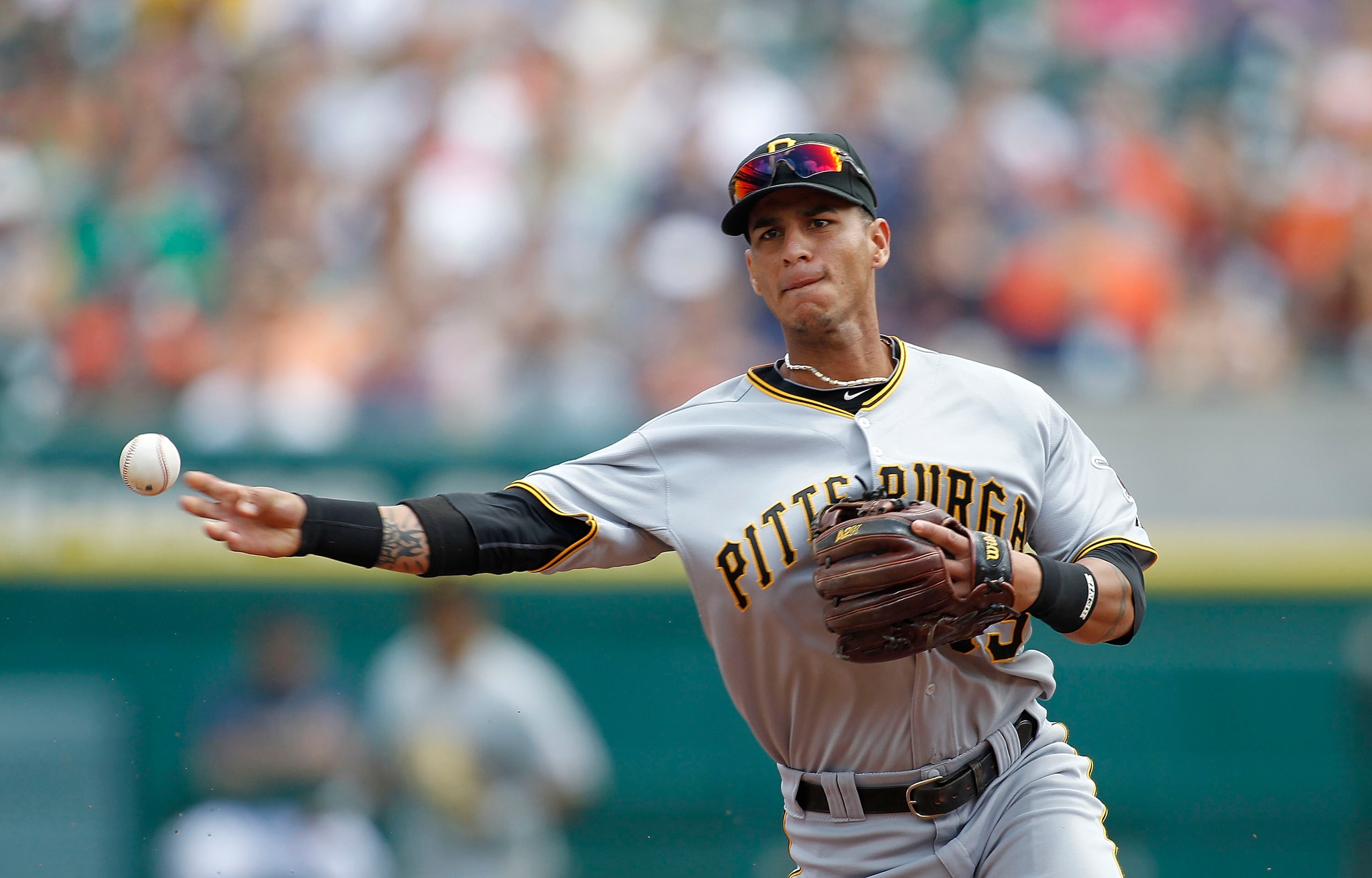DETROIT - JUNE 13: Ronny Cedeno #13 of the Pittsburgh Pirates throws out Ryan Raburn #25 of the Detroit Tigers in the second inning during the game on June 13, 2010 at Comerica Park in Detroit, Michigan. The Tigers defeated the Pirates 4-3.  (Photo by Leo