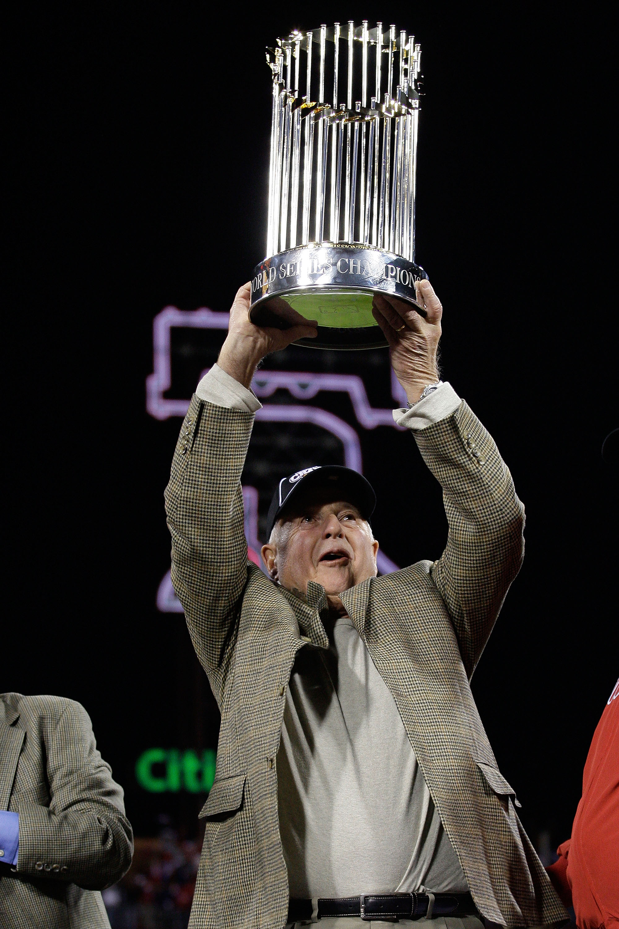 PHILADELPHIA - OCTOBER 29:  (L-R) General Manager Pat Gillick of of the Philadelphia Phillies celebrates with the World Series trophy after their 4-3 win against the Tampa Bay Rays during the continuation of game five of the 2008 MLB World Series on Octob