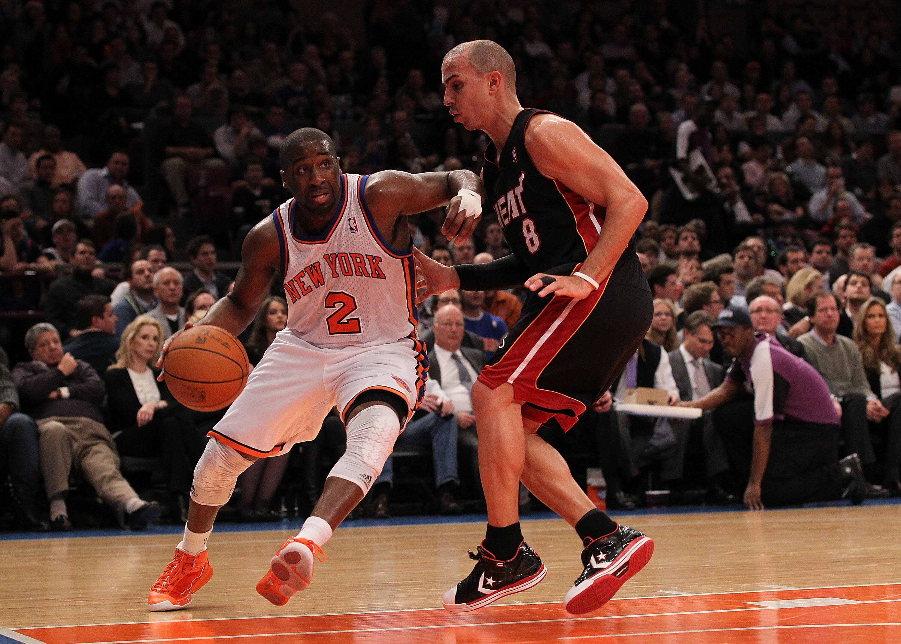 NEW YORK - DECEMBER 17:  Raymond Felton #2 of the New York Knicks dribbles against Carlos Arroyo #8 of the Miami Heat at Madison Square Garden on December 17, 2010 in New York, New York.  (Photo by Al Bello/Getty Images)