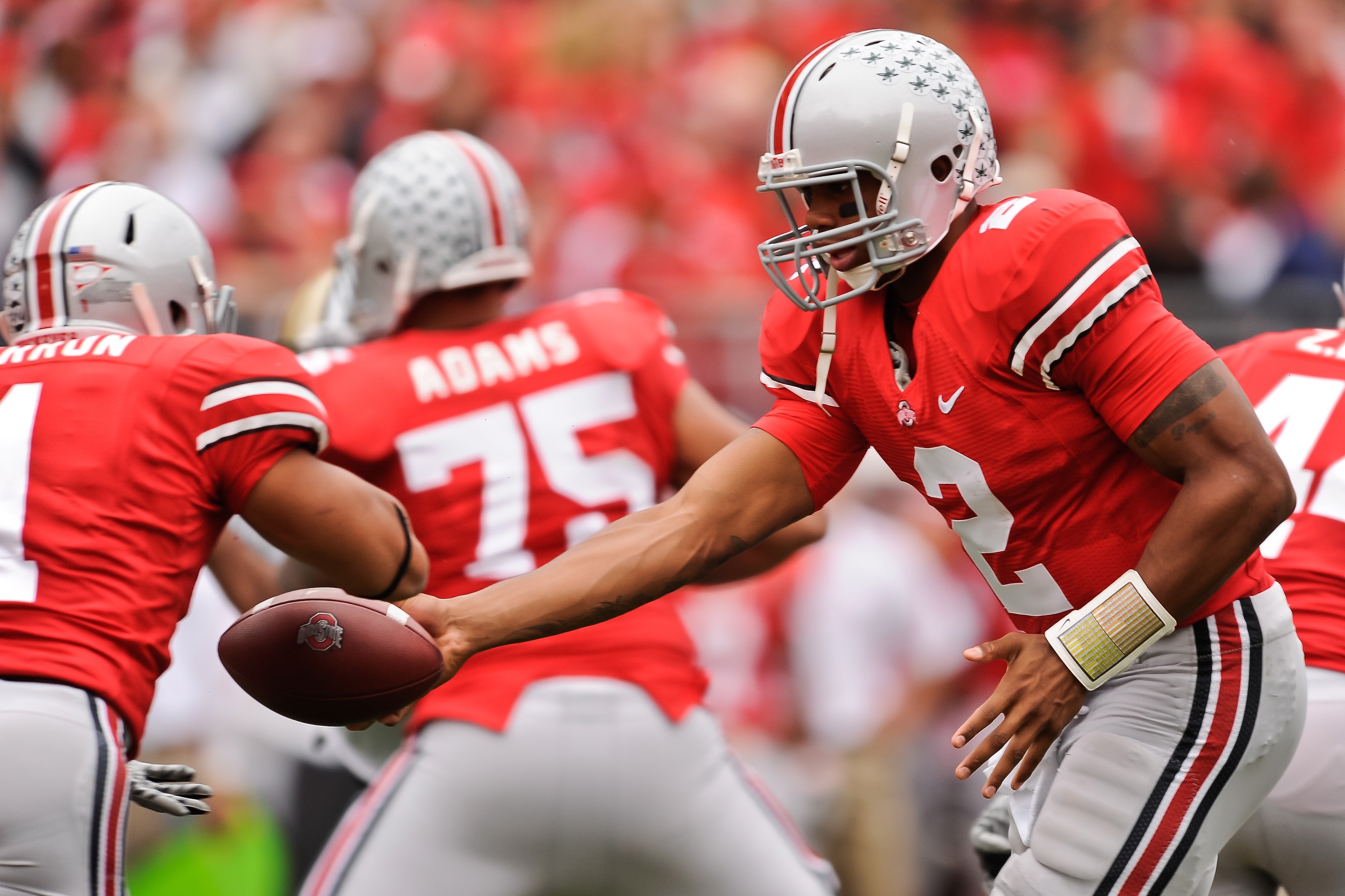 COLUMBUS, OH - OCTOBER 23:  Terrelle Pryor #2 of the Ohio State Buckeyes hands off the ball to Dan Herron #1 of the Ohio State Buckeyes  against the Purdue Boilermakers at Ohio Stadium on October 23, 2010 in Columbus, Ohio.  (Photo by Jamie Sabau/Getty Im