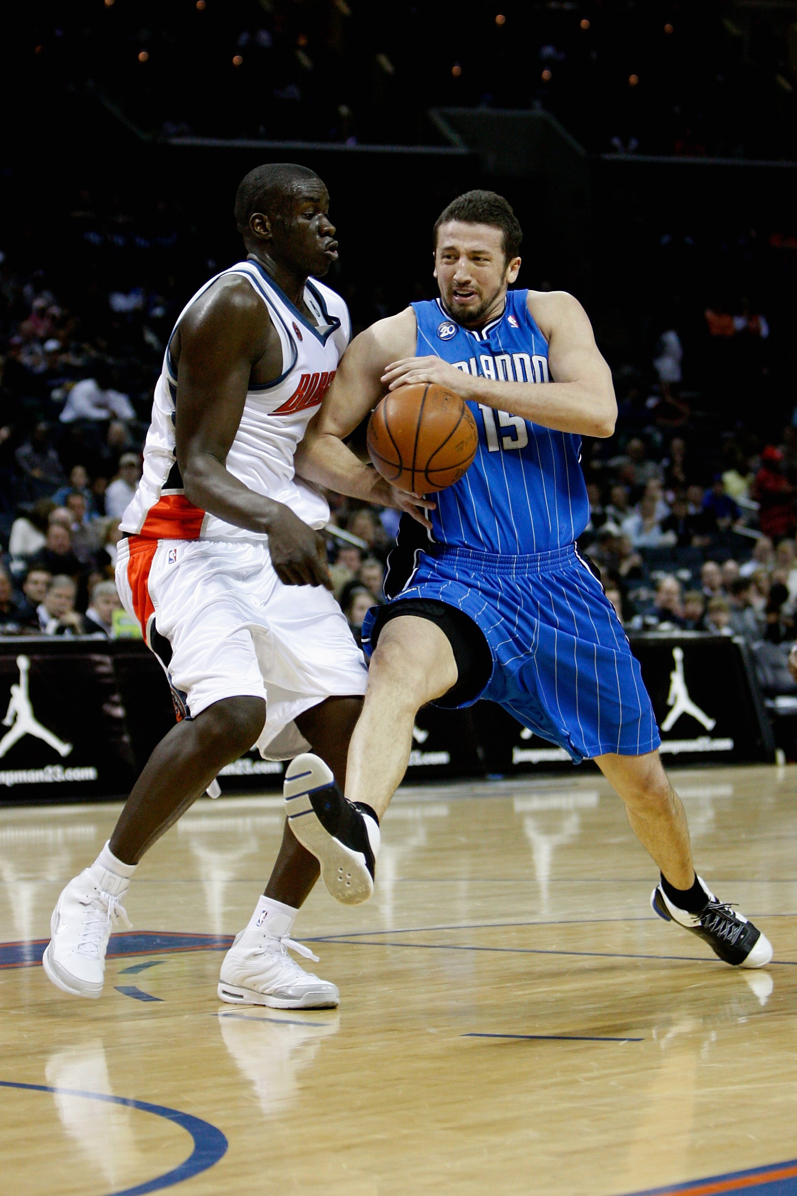 CHARLOTTE, NC - FEBRUARY 20:  Hedo Turkoglur #15 of the Orlando Magic drives to the basket past DeSagana Diop #7 of the Charlotte Bobcats during their game on February 20, 2009 at Time Warner Cable Arena  in Charlotte, North Carolina.  The Magic won 92-80