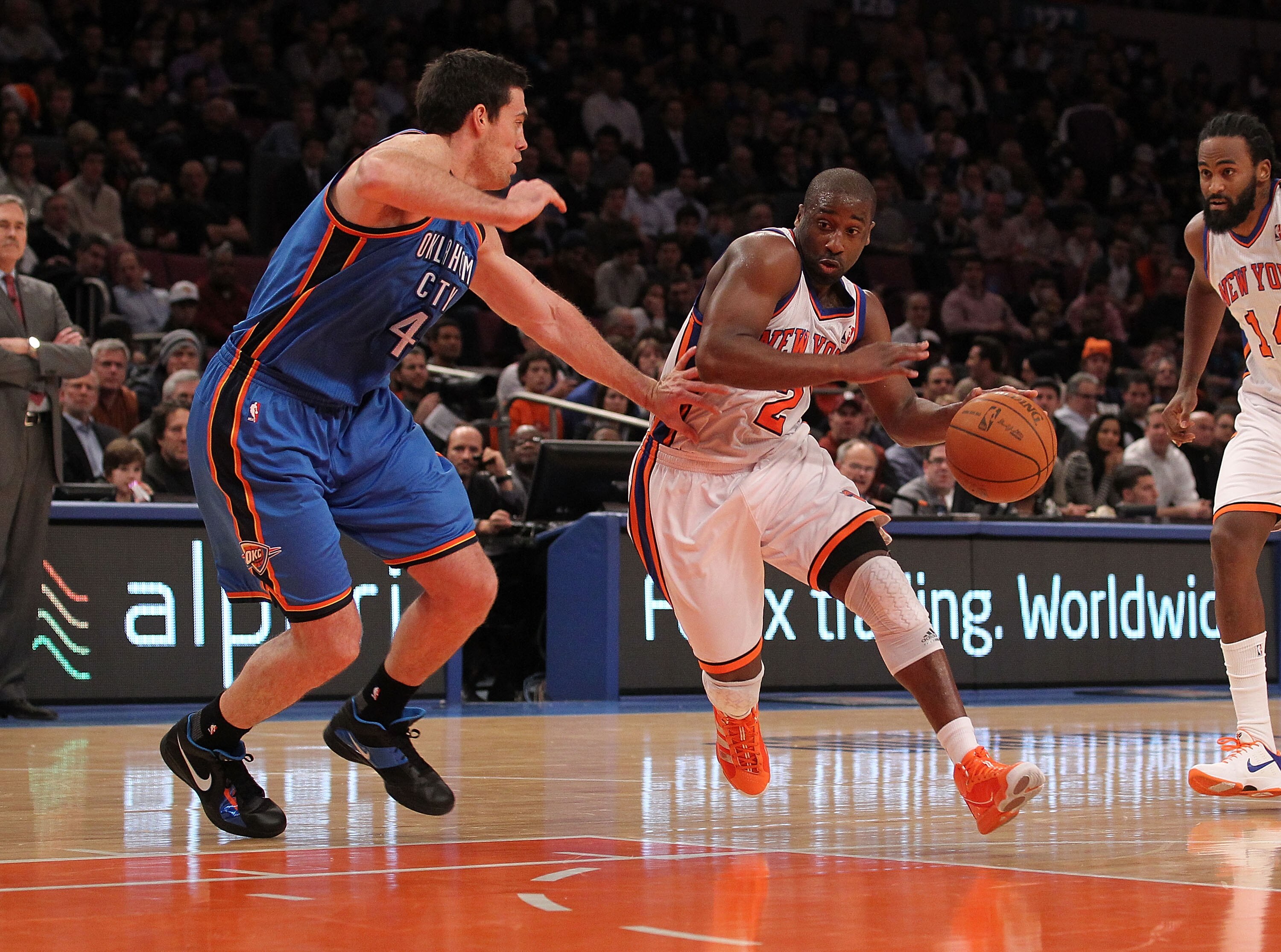 NEW YORK - DECEMBER 22:  Raymond Felton #2 of the New York Knicks drives against Nick Collison #4 of the Oklahoma City Thunder at Madison Square Garden on December 22, 2010 in New York, New York.   NOTE TO USER: User expressly acknowledges and agrees that