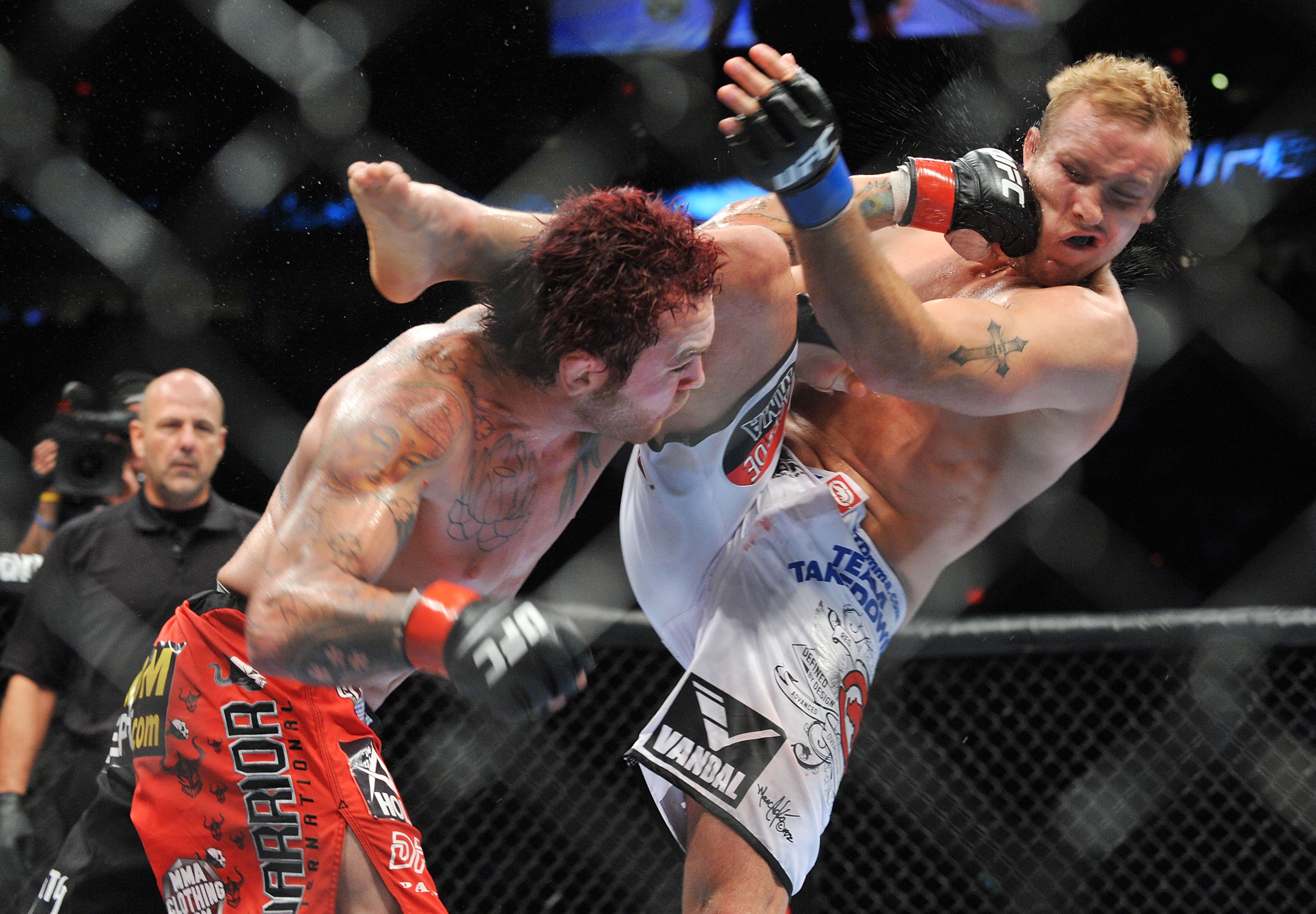 PORTLAND, OR - AUGUST 29:  UFC fighter Chris Leben (L) battles UFC fighter Jake Rosholt (R) during their Middleweight bout at UFC 102:  Couture vs. Nogueira at the Rose Garden Arena on August 29, 2009 in Portland, Oregon.  (Photo by Jon Kopaloff/Getty Ima