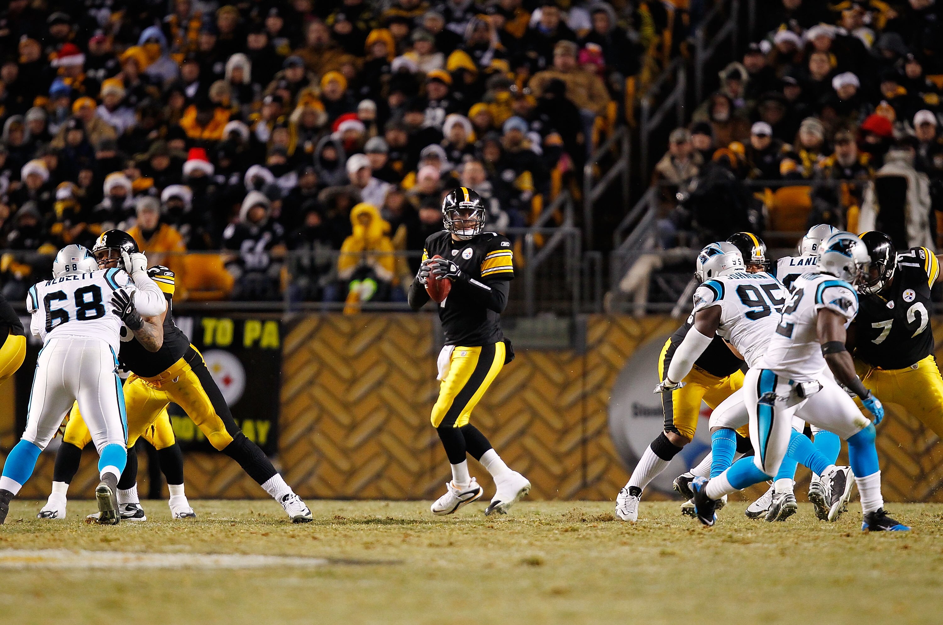 PITTSBURGH - DECEMBER 23:  Ben Roethlisberger #7 of the Pittsburgh Steelers drops back to pass during the game against the Carolina Panthers on December 23, 2010 at Heinz Field in Pittsburgh, Pennsylvania.  (Photo by Jared Wickerham/Getty Images)
