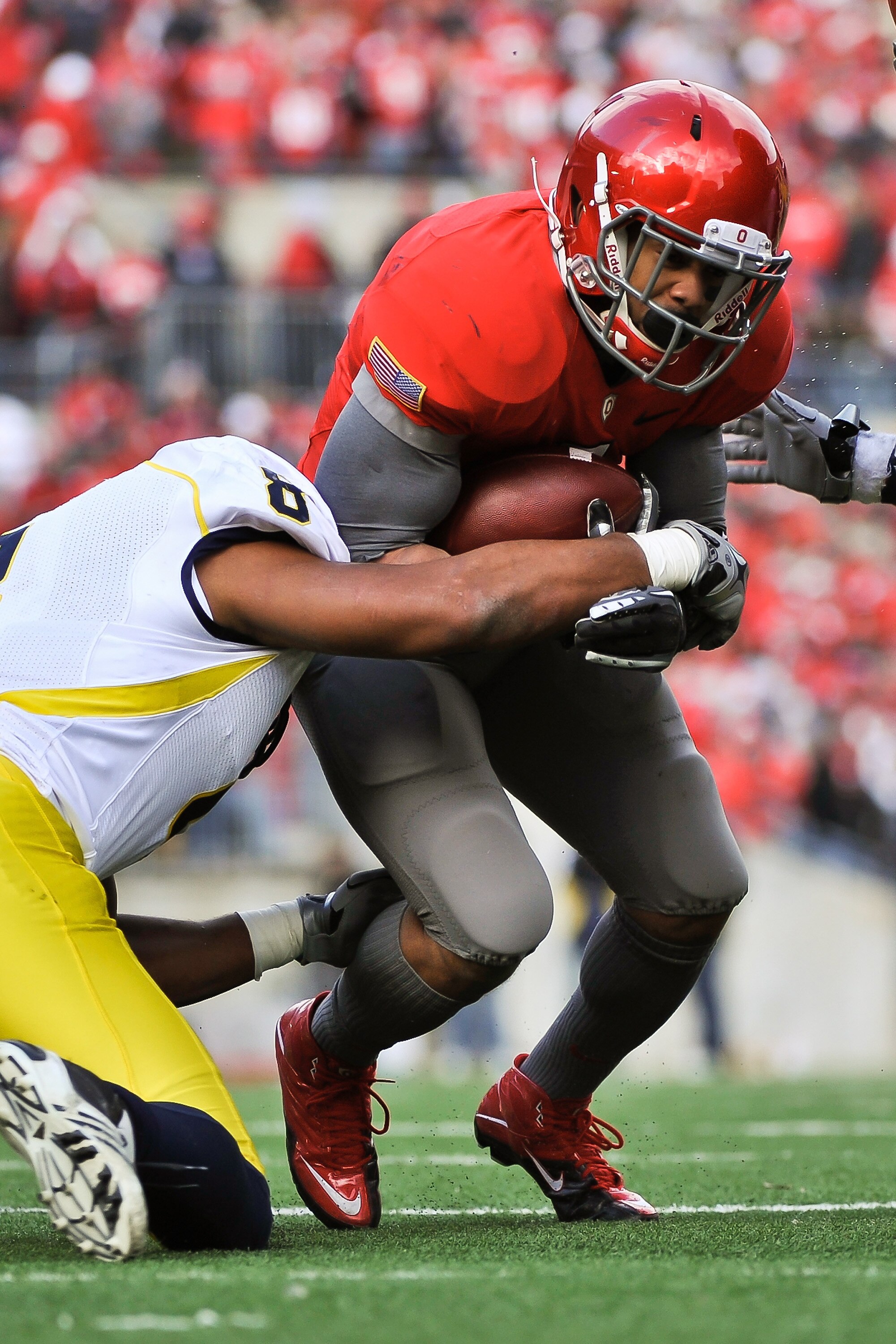 COLUMBUS, OH - NOVEMBER 27:  Dan Herron #1 of the Ohio State Buckeyes  runs with the ball against the Michigan Wolverines at Ohio Stadium on November 27, 2010 in Columbus, Ohio.  (Photo by Jamie Sabau/Getty Images)