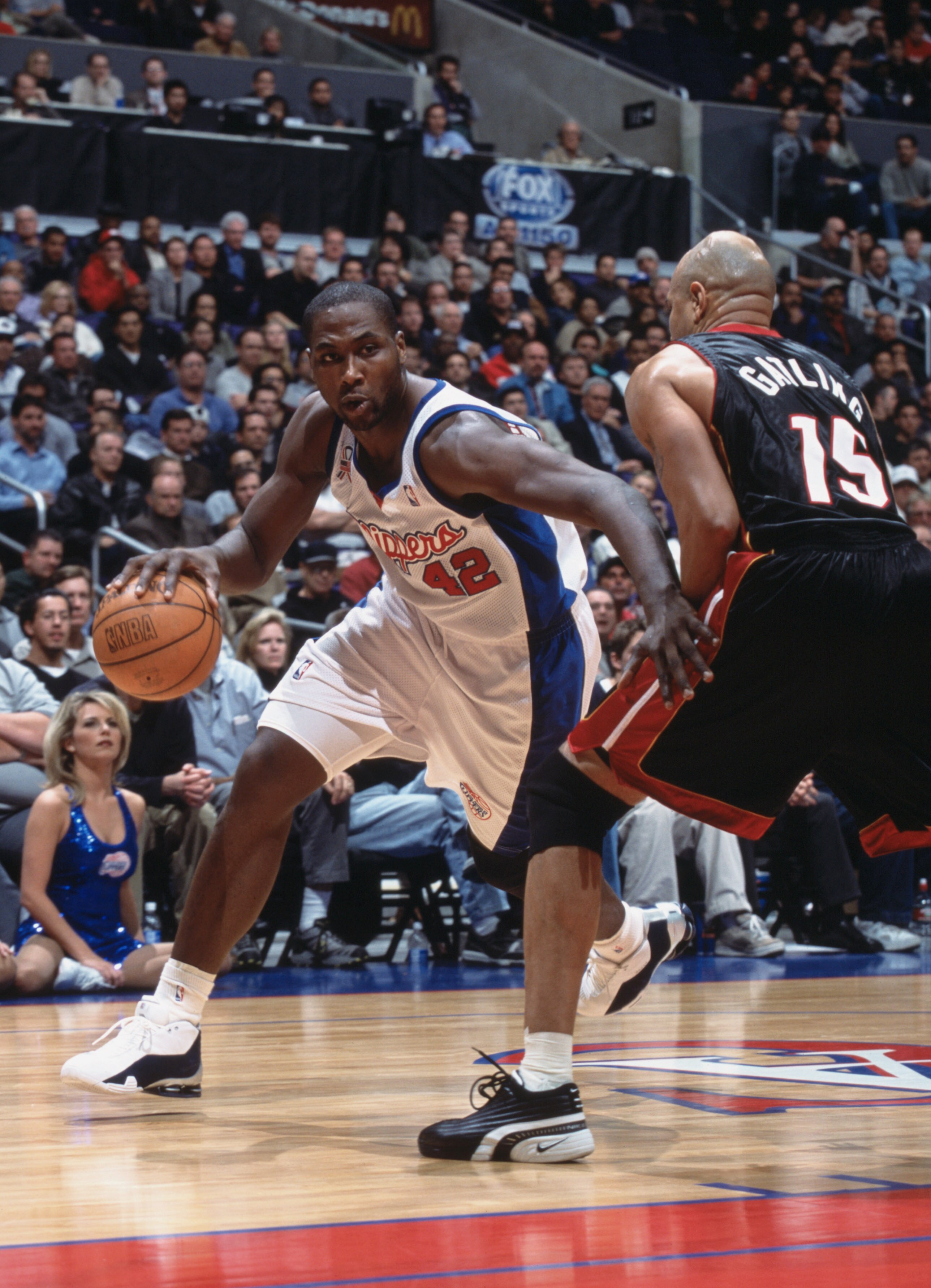 4 Dec 2001:  Forward Elton Brand #42 of the Los Angeles Clippers drives past forward Chris Gatling #15 of the Miami Heat during the NBA game at the Staples Center in Los Angeles, California. The Clippers defeated the Heat 87-83.  NOTE TO USER:  User expre
